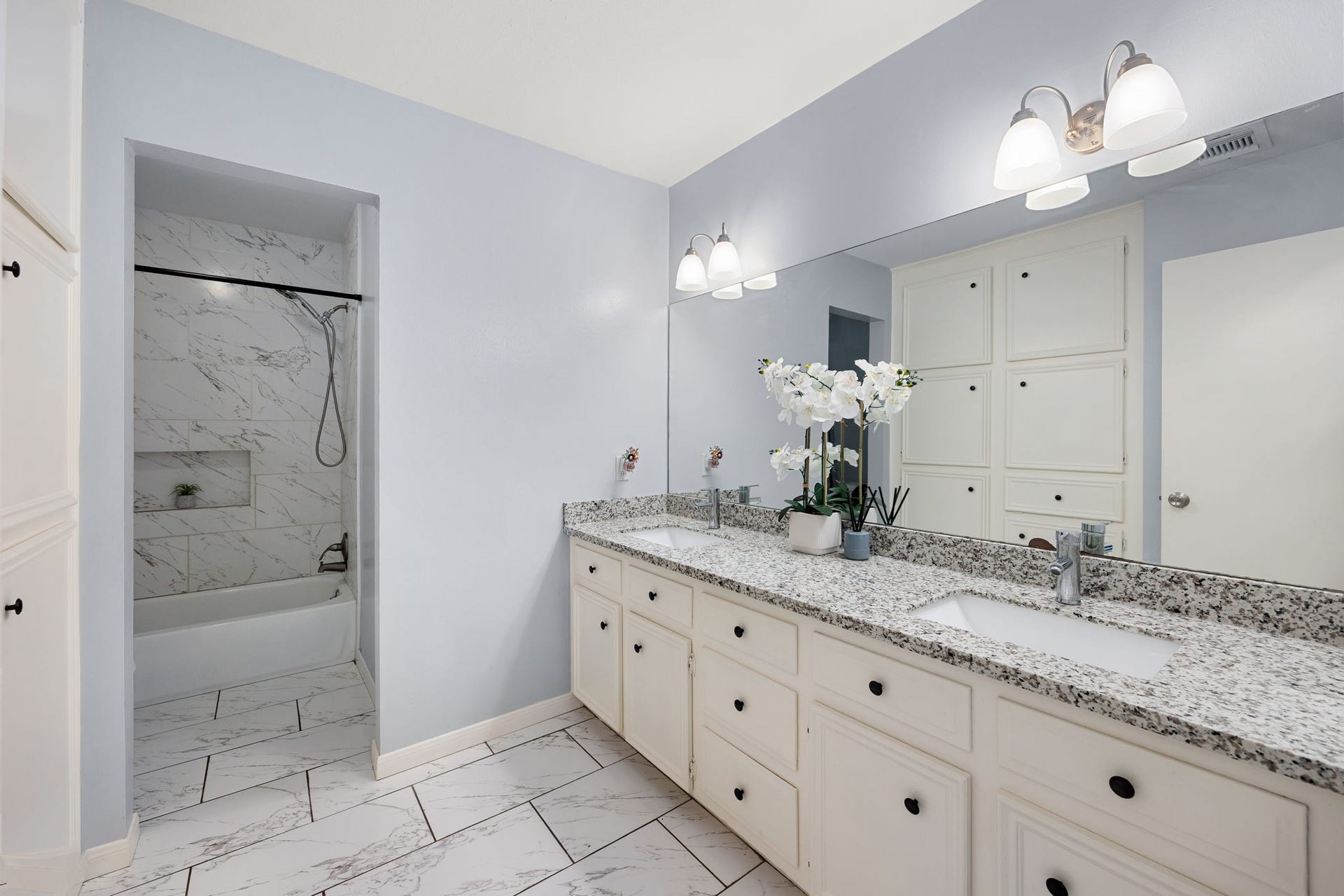 20102 Wickham Court, Katy, TX 77450 Bathroom with double vanity, granite countertop, large mirror, and a tub with shower area