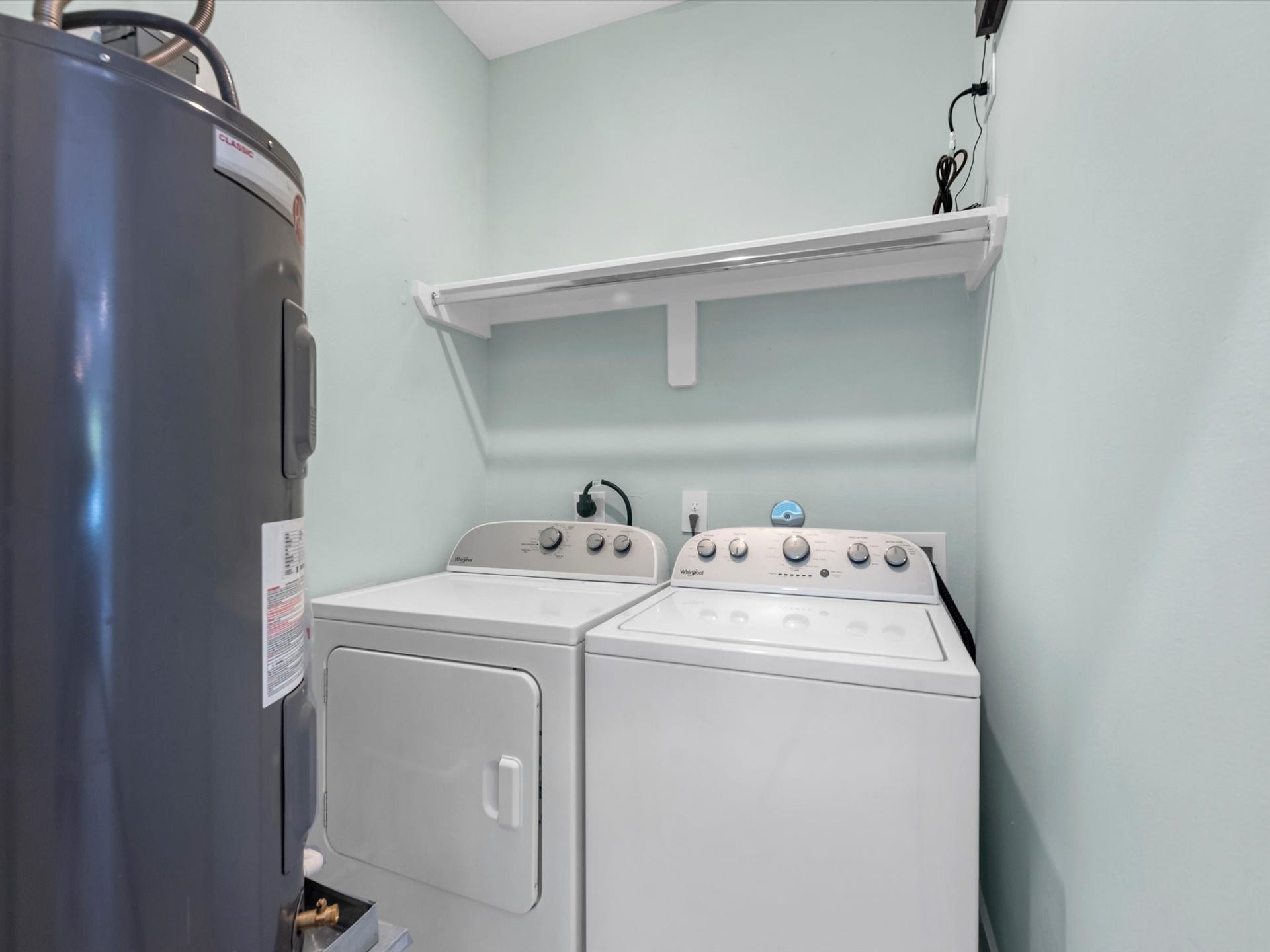 Utility room with new whaser and dryer