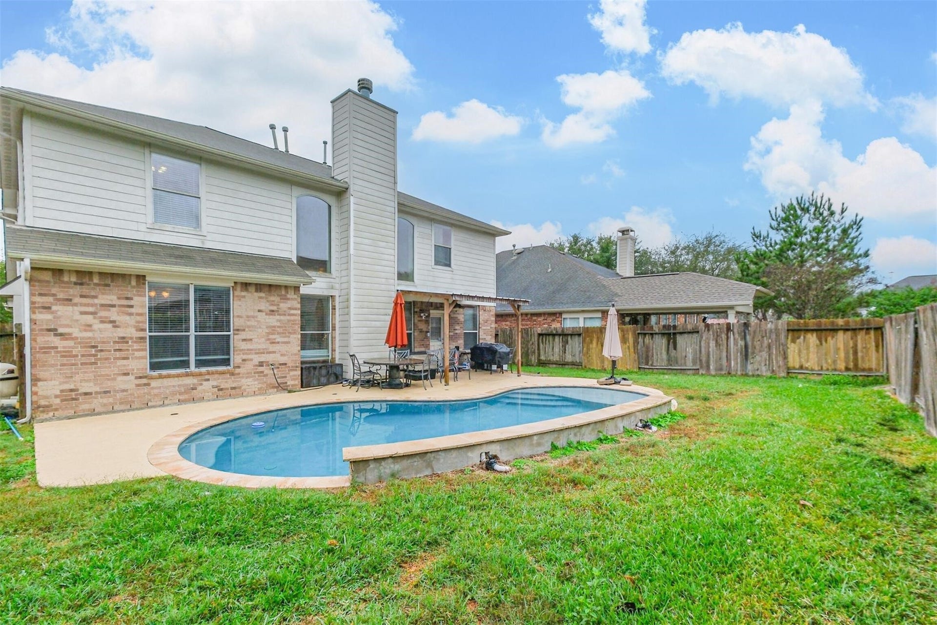 14907 E Lime Blossom Court, Cypress, TX 77433 Step outside and discover a backyard designed for relaxation and outdoor enjoyment.