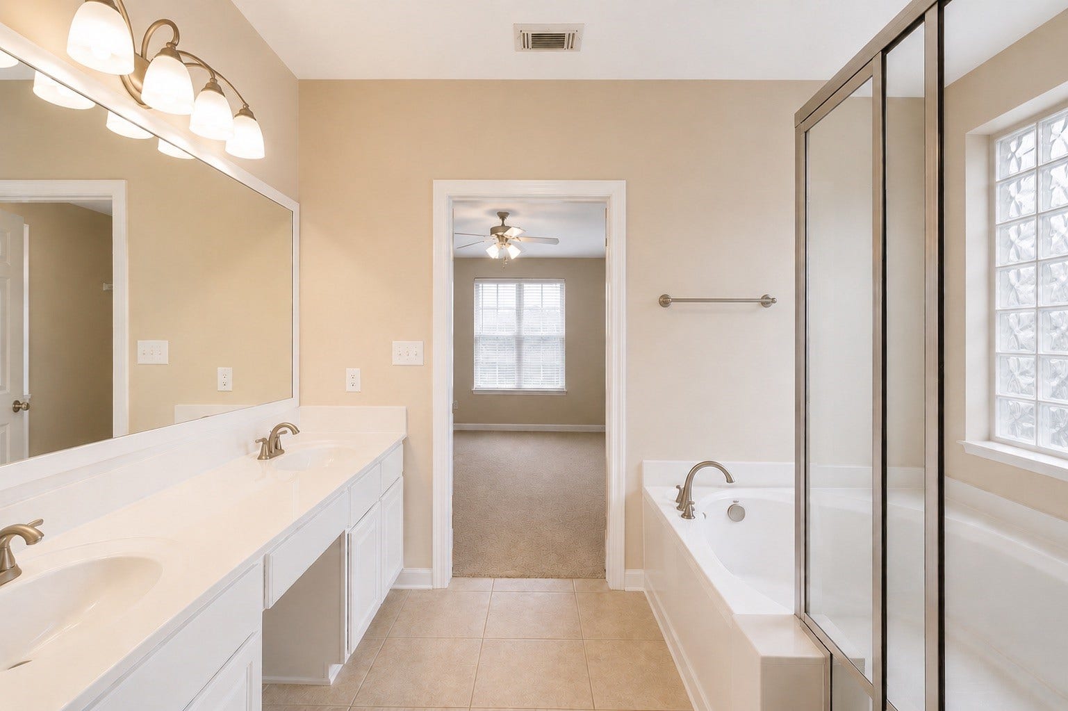14907 E Lime Blossom Court, Cypress, TX 77433 The ensuite bathroom features a soaking tub perfect for unwinding after a long day.