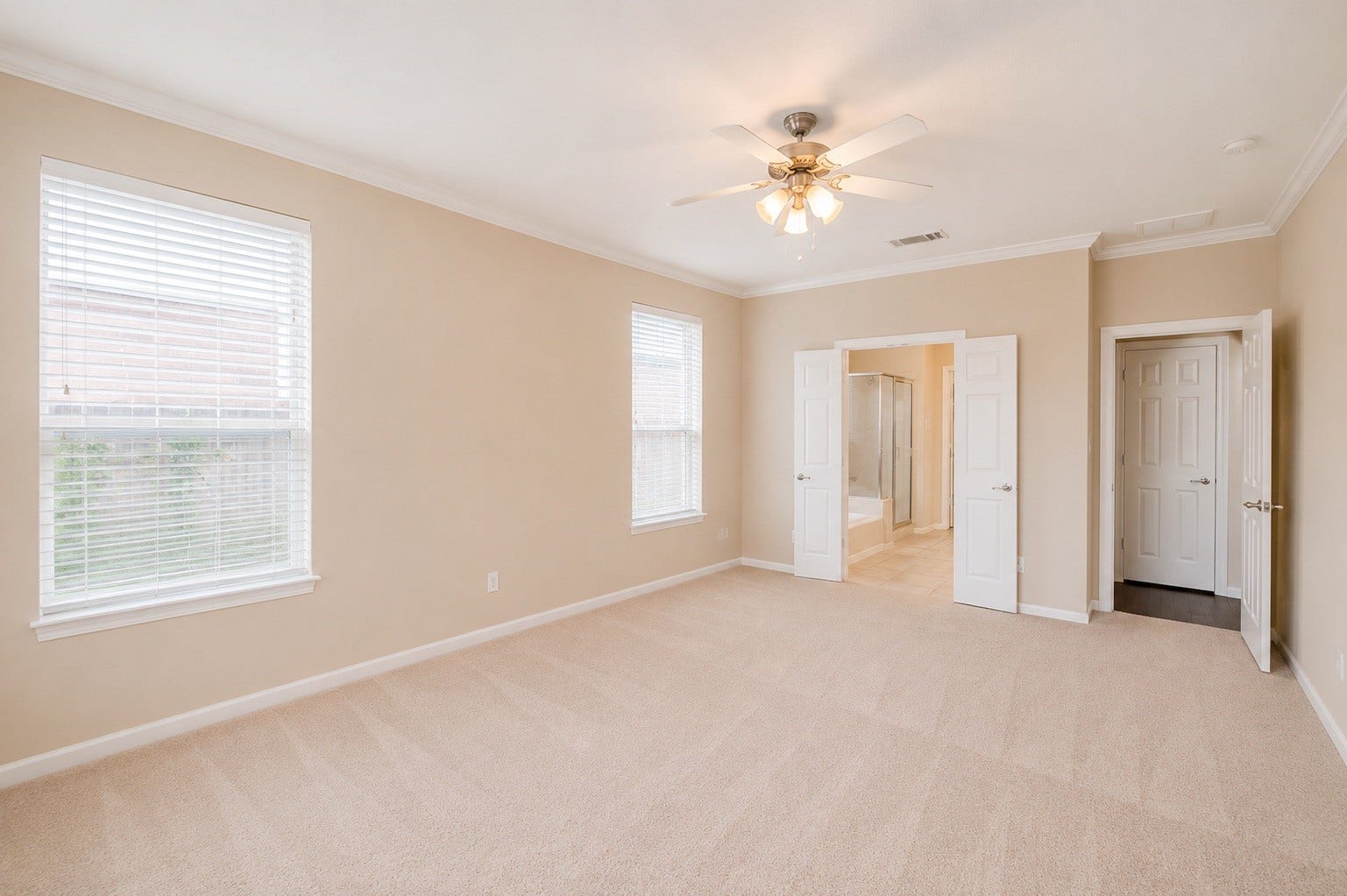 14907 E Lime Blossom Court, Cypress, TX 77433 Large windows bring in soft natural light while providing views of the backyard.