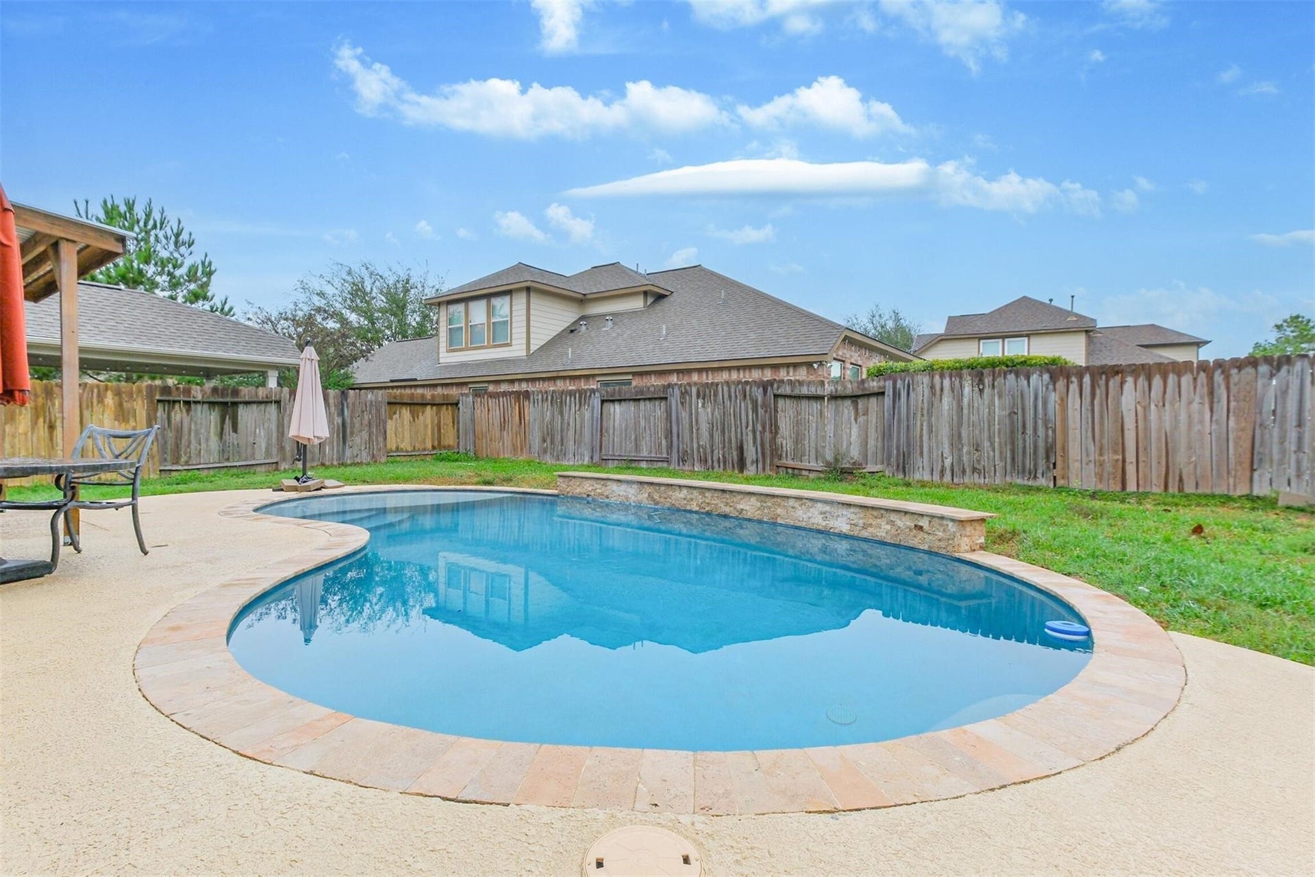 14907 E Lime Blossom Court, Cypress, TX 77433 The sparkling pool creates the perfect place to cool off during warm Houston summers.