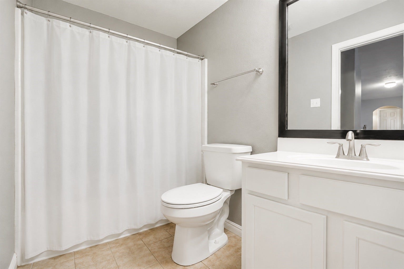 14907 E Lime Blossom Court, Cypress, TX 77433 Full bathroom well-positioned to accommodate both family members and guests.