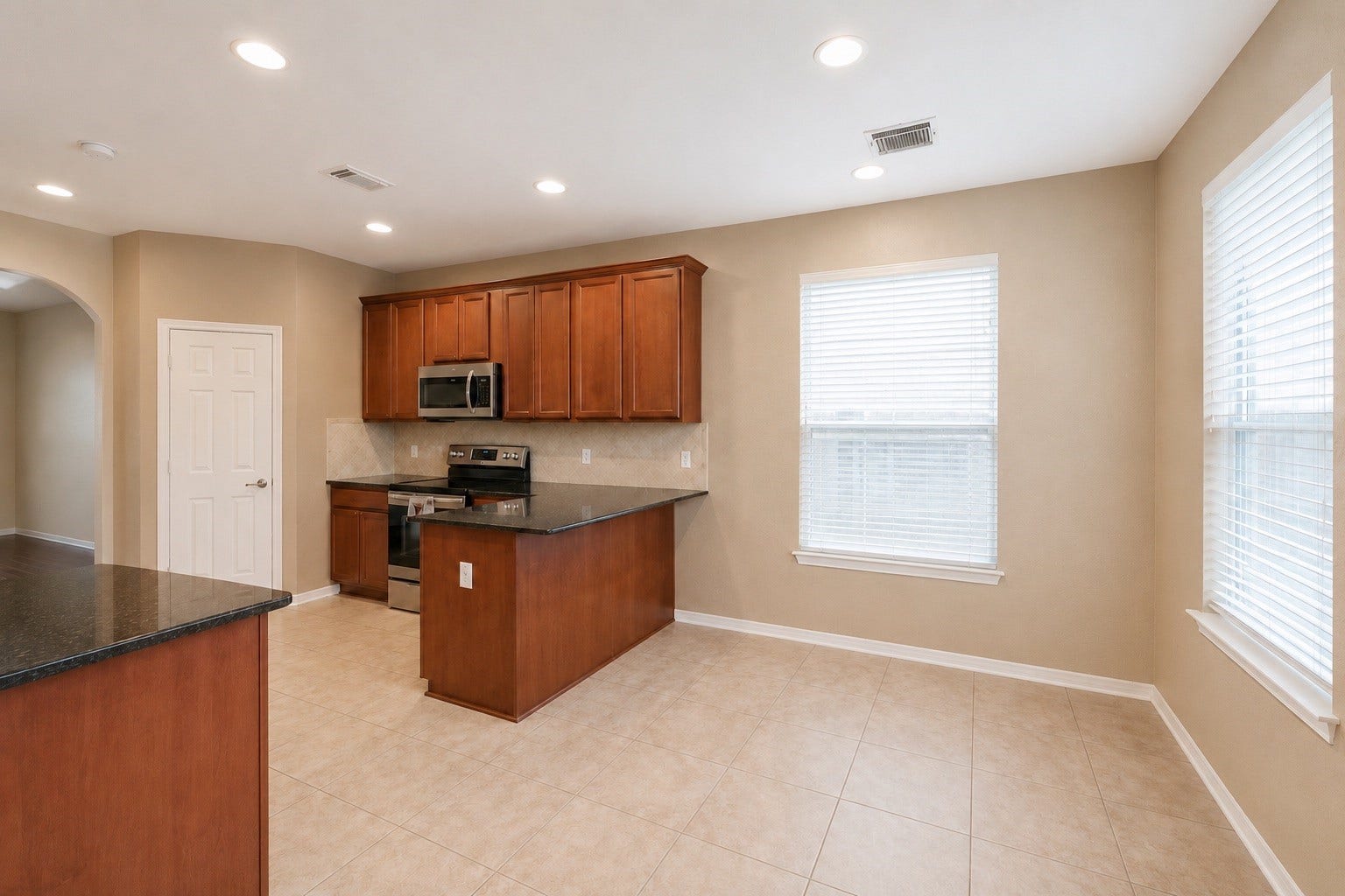 14907 E Lime Blossom Court, Cypress, TX 77433 Adjacent to the kitchen, the breakfast area is surrounded by natural light and offers a cheerful space to start your day.