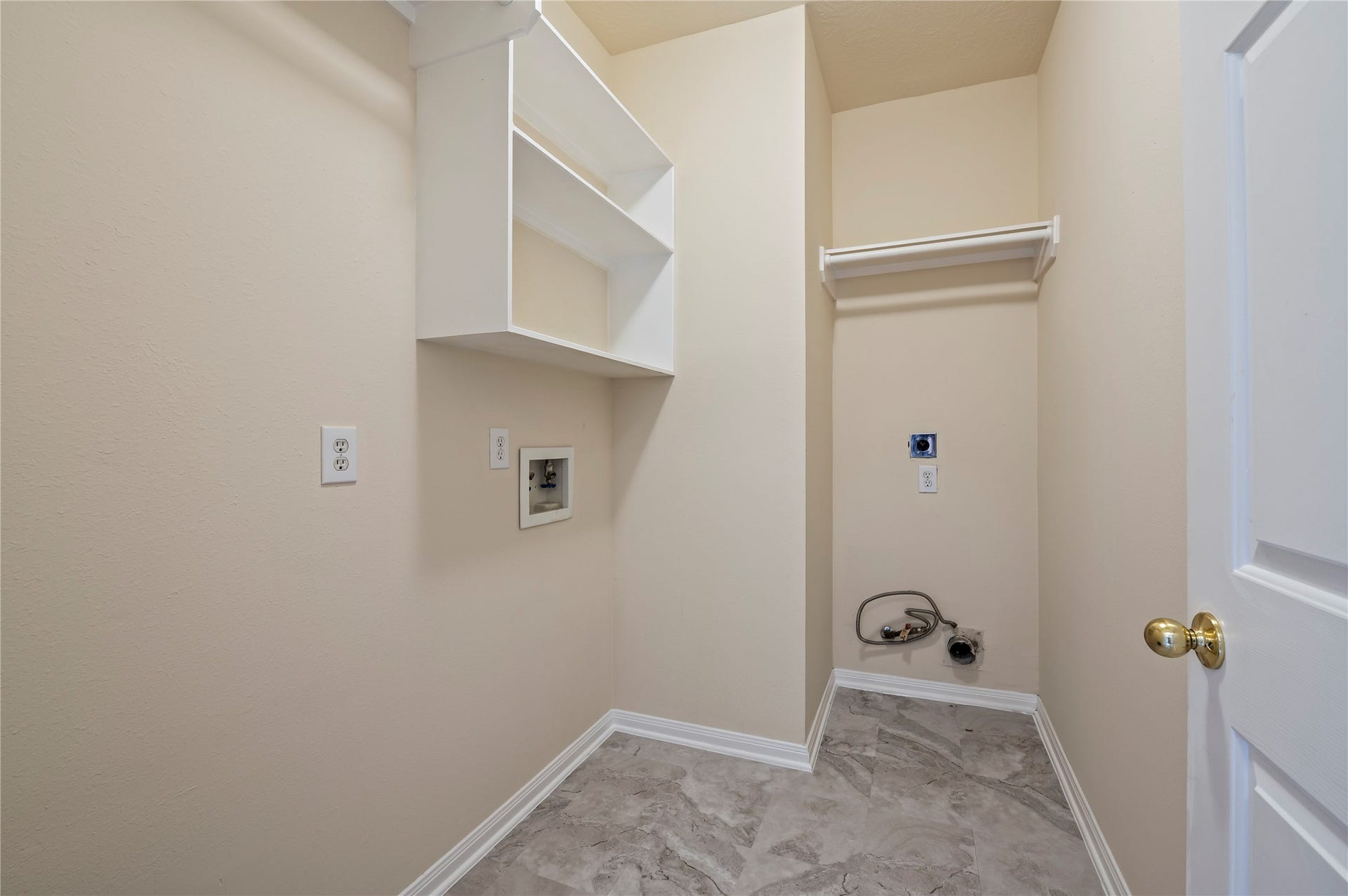 Laundry room downstairs. Gas and electric dryers connections