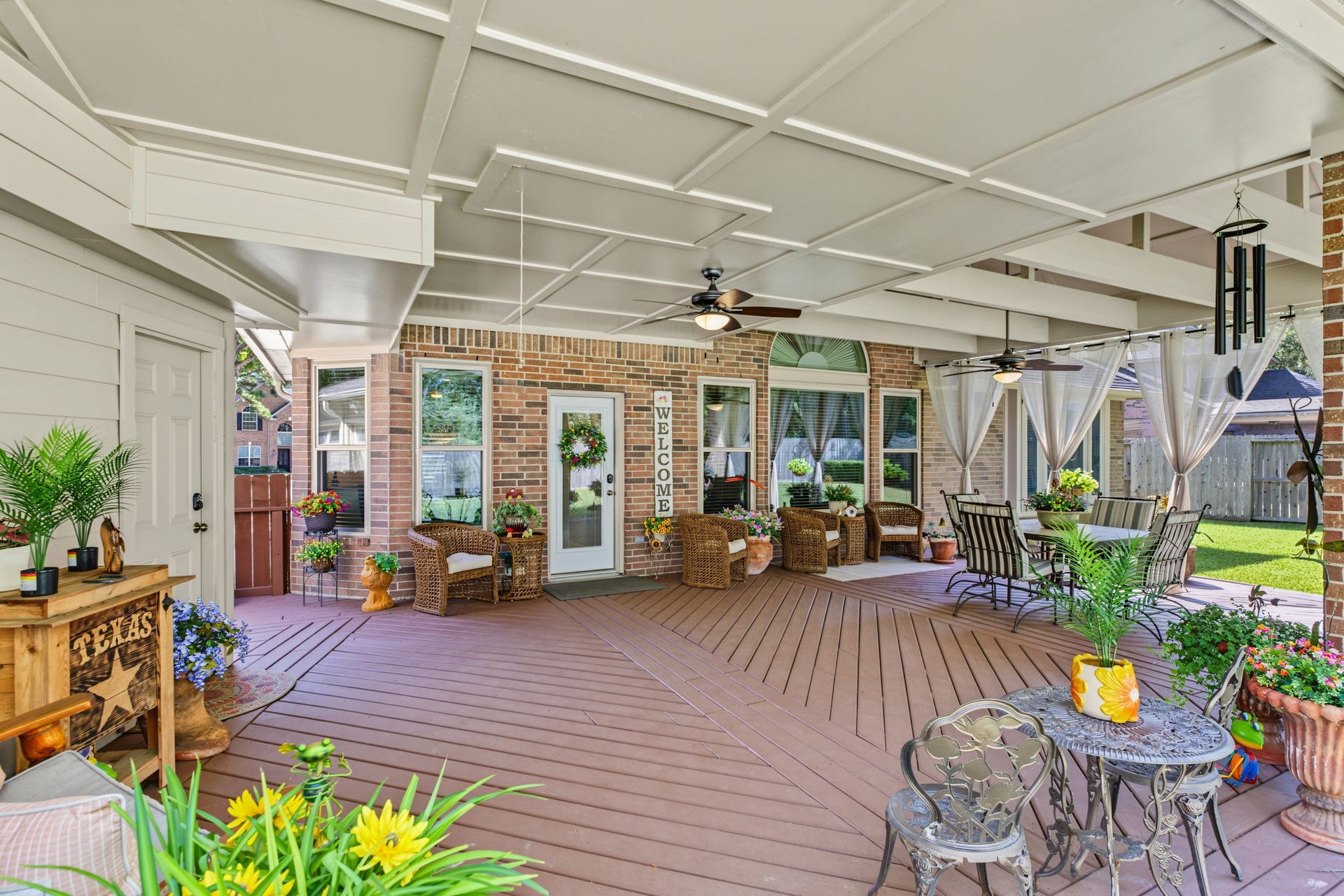 4807 Stonecrop Court, Houston, TX 77345 View from one corner of the back patio looking back at the deck. You can see the attic staircase better here.