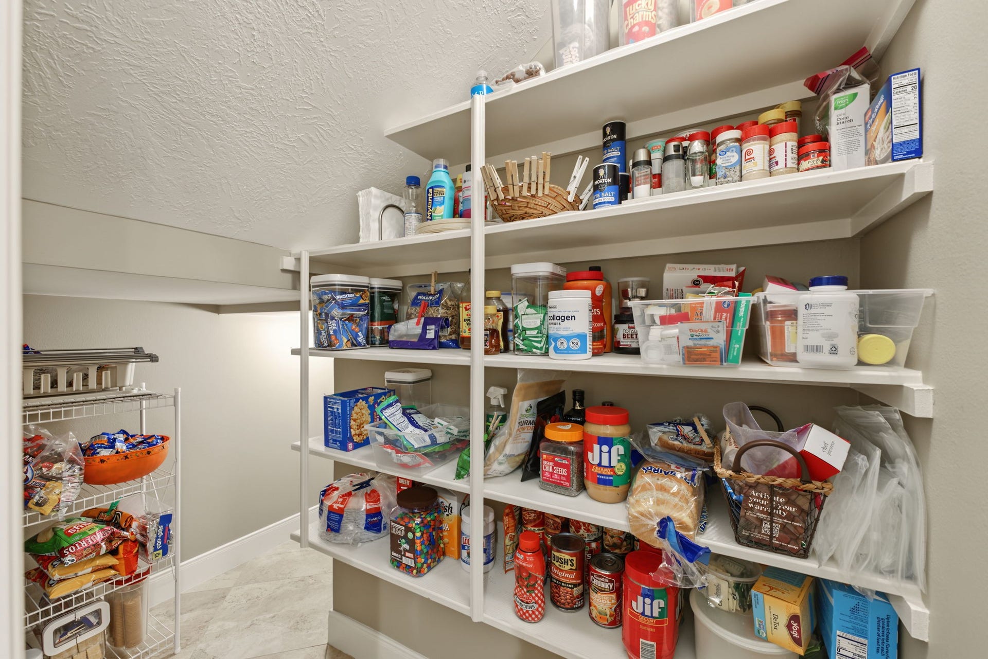 4807 Stonecrop Court, Houston, TX 77345 This Pantry goes around the corner and makes another turn behind that wall! Great storage