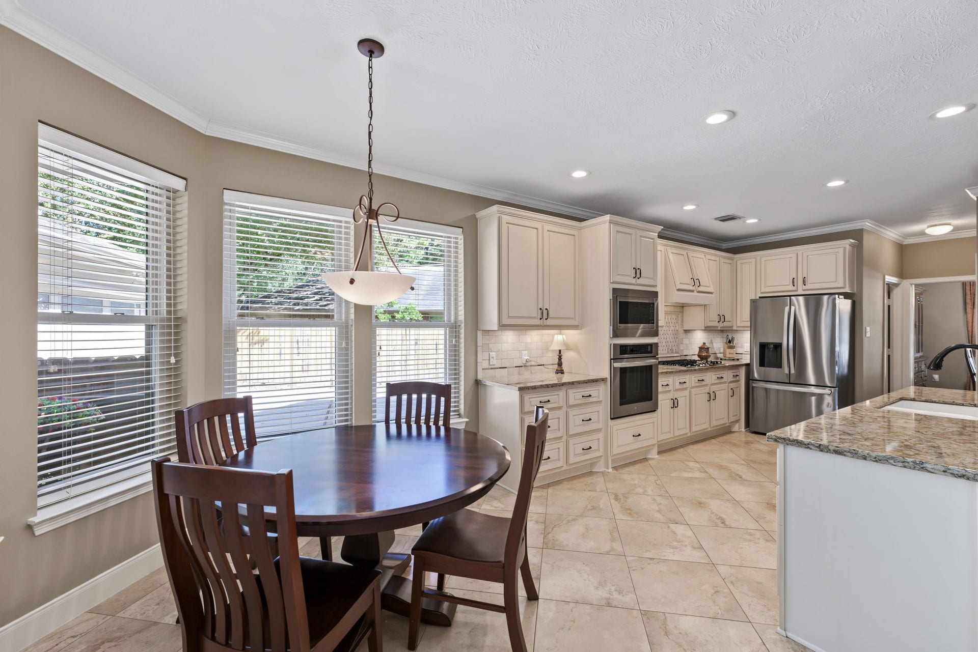 4807 Stonecrop Court, Houston, TX 77345 The breakfast area overlooks the backyard, driveway, and family room.