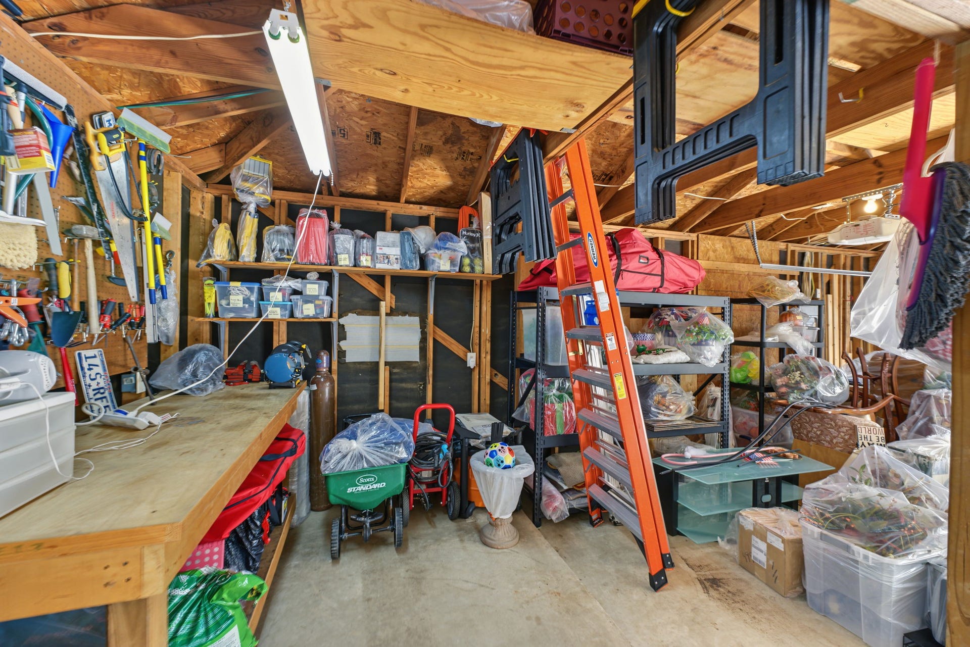 4807 Stonecrop Court, Houston, TX 77345 This is a workshop area in the back corner of the garage. There used to be a mini-split in that wall where the gray square is.