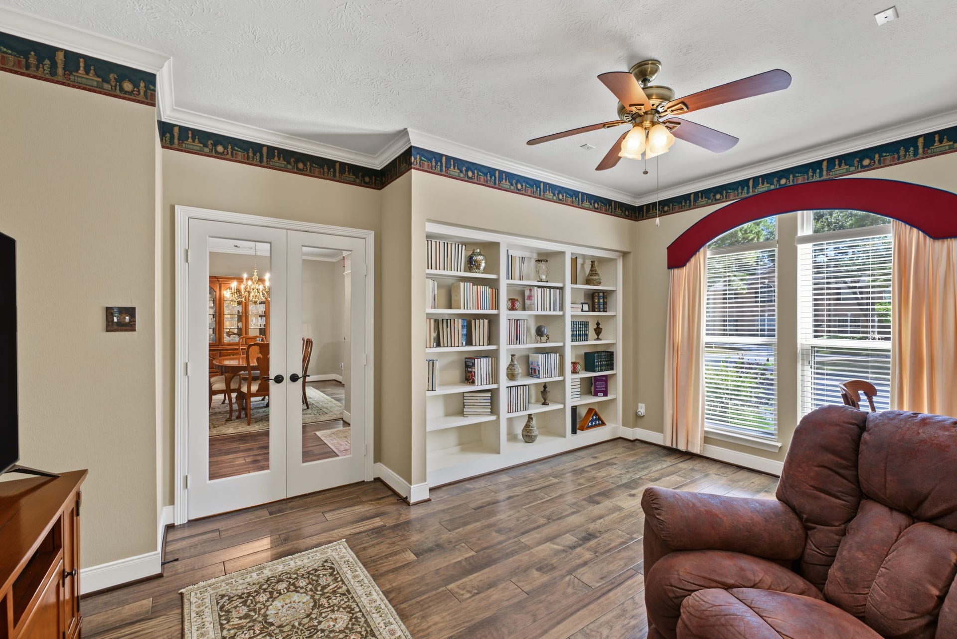 4807 Stonecrop Court, Houston, TX 77345 This front Study/Office is large at approx 17' x 11' with double French doors and built in shelving.