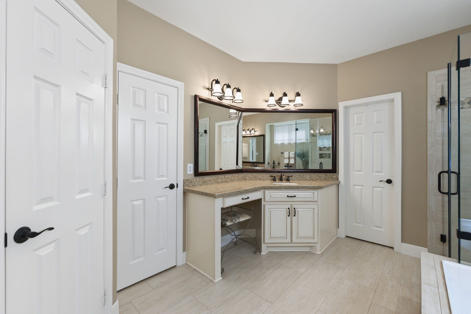 4807 Stonecrop Court, Houston, TX 77345 Door on the left leads to the toilet. Door in the middle is one closet and door on the right is another closet.