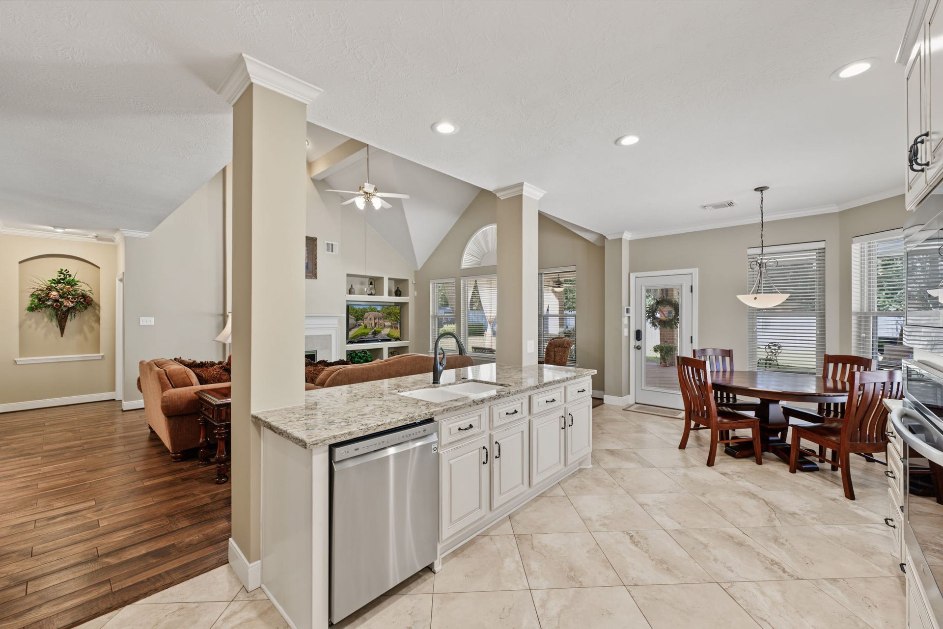 4807 Stonecrop Court, Houston, TX 77345 View from the kitchen fridge area showing the openness of the kitchen space and views into the Family Room.