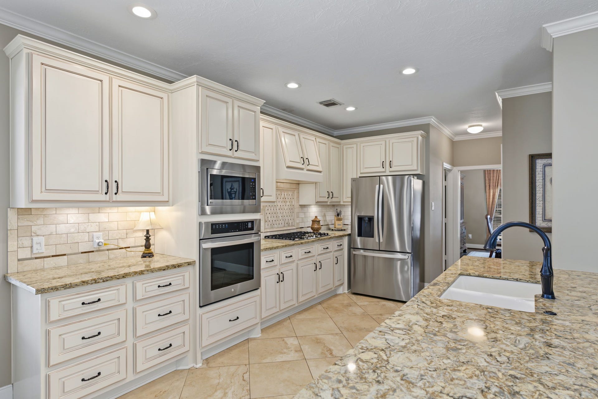 4807 Stonecrop Court, Houston, TX 77345 Updated kitchen with a bank of pull out drawers and "Smart ThinQ" technology appliances that can connect to Alexa!