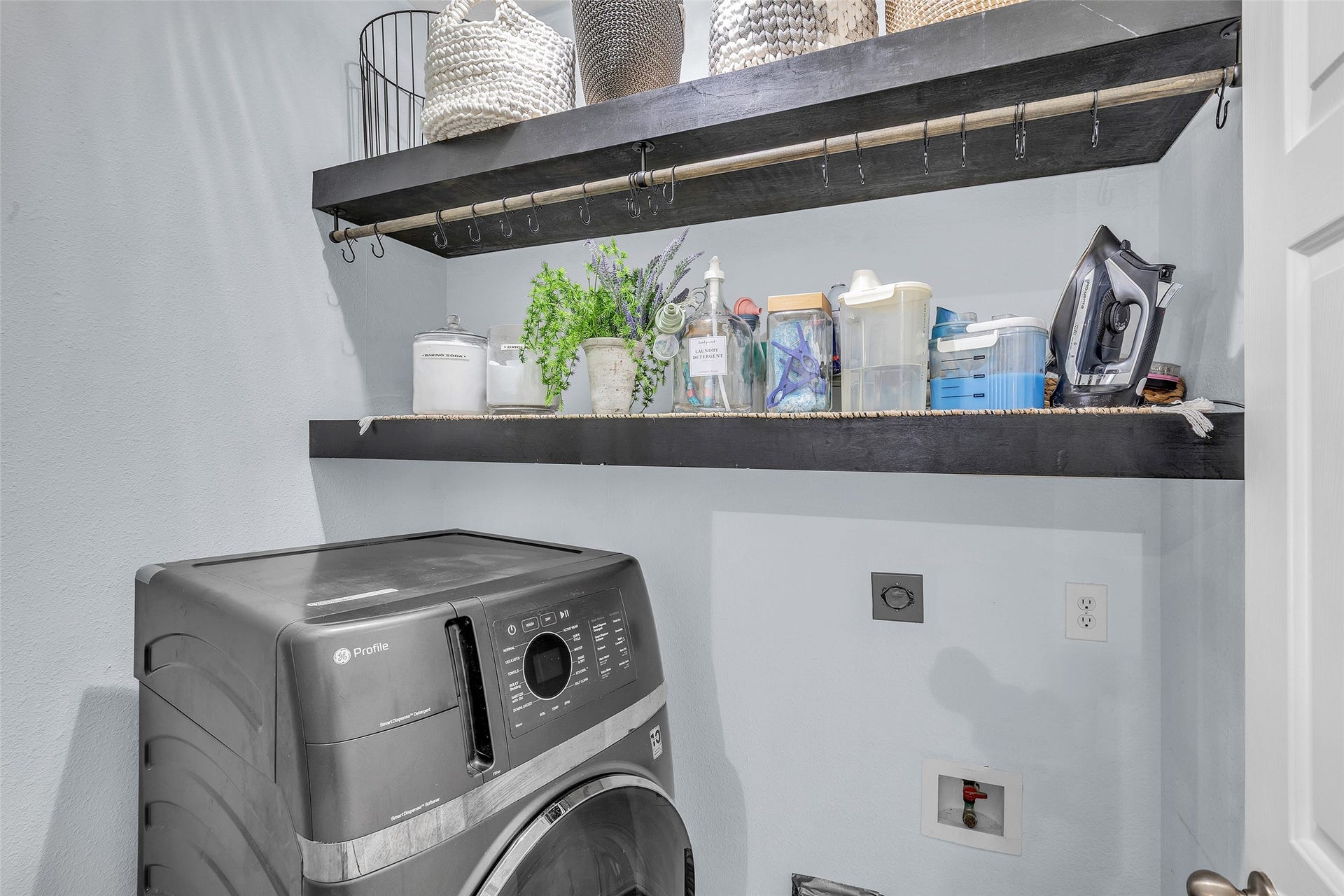 1408 S Friendswood Drive, #1301, Friendswood, TX 77546 Conveniently located utility room with added shelving and storage.