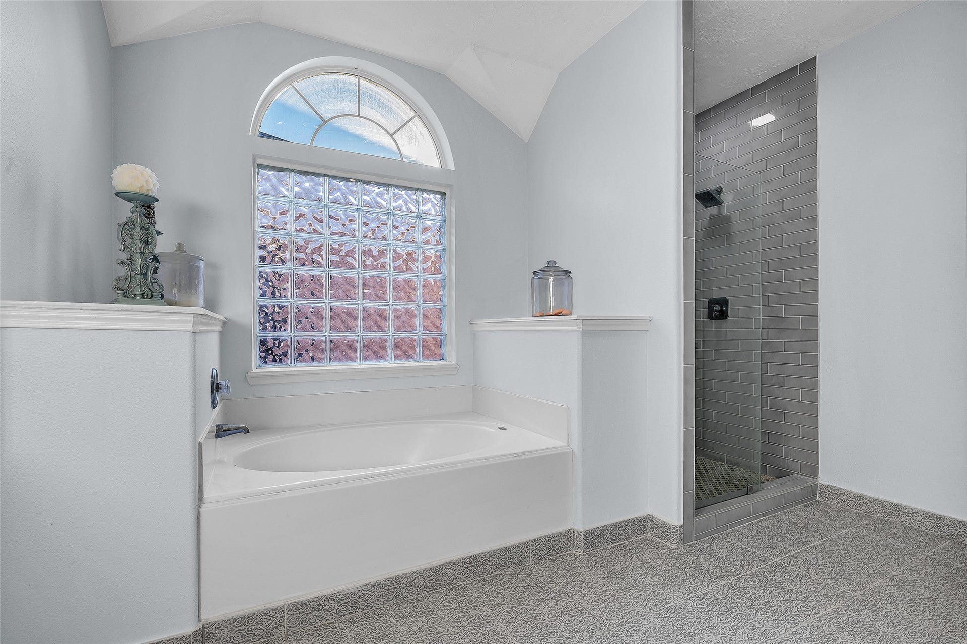 1408 S Friendswood Drive, #1301, Friendswood, TX 77546 Featuring new tile, fixtures, and more this renovated bathroom is the perfect place to start and finish your day.