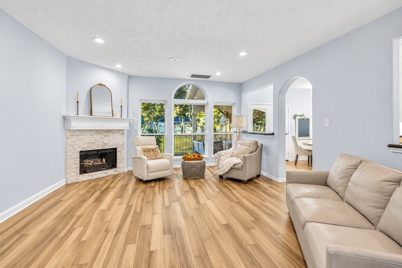 1408 S Friendswood Drive, #1301, Friendswood, TX 77546 Incredible natural light fills this main living space. Recently updated backsplash on the fireplace is a wonderful touch.