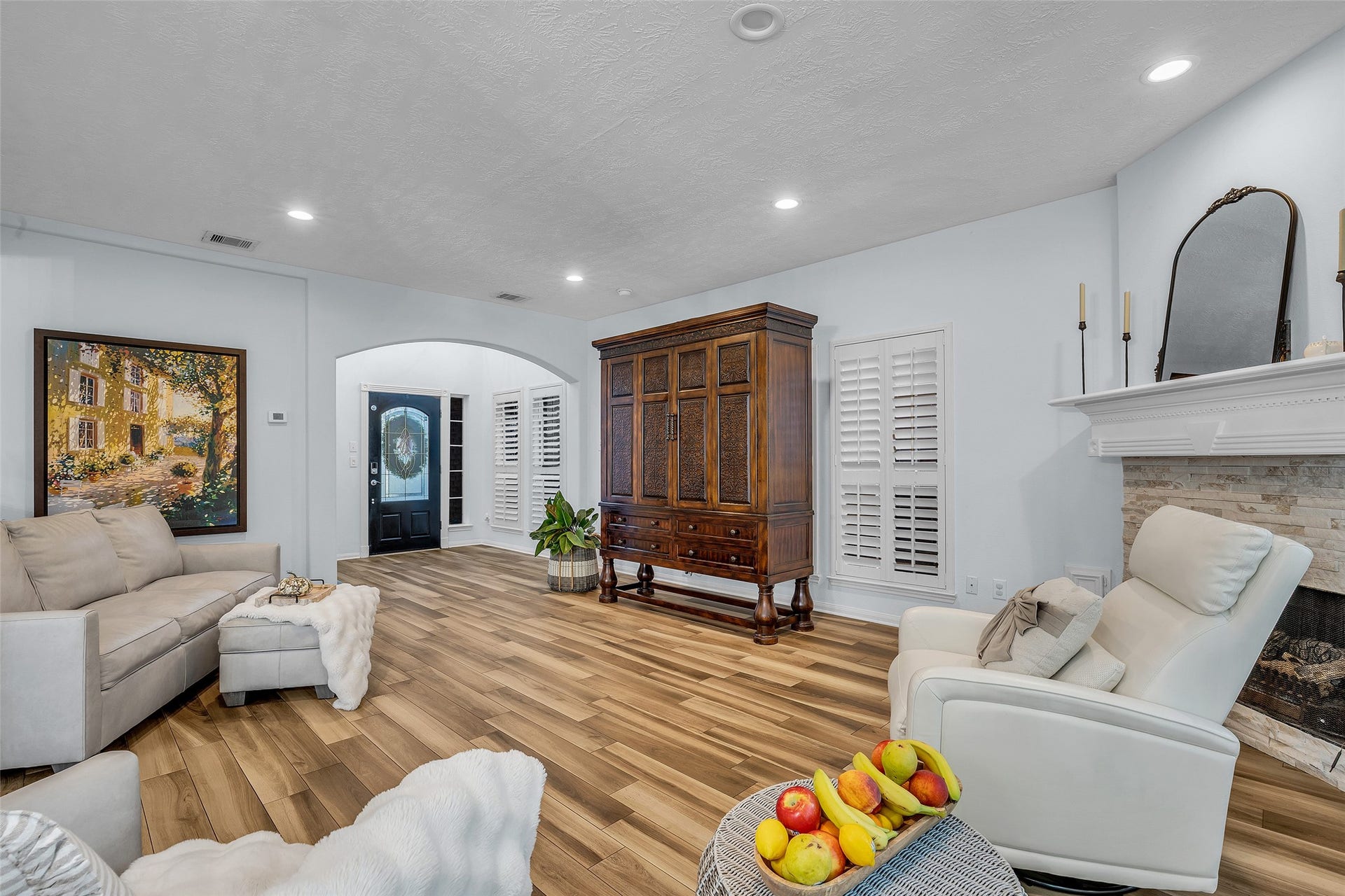 1408 S Friendswood Drive, #1301, Friendswood, TX 77546 Recessed lighting and upgraded custom plantation shutters stand out as well as the grand mantle on this fireplace.