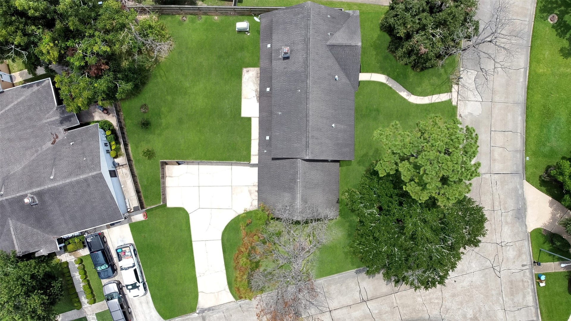 15503 Wandering Trail, Friendswood, TX 77546 Aerial views showcase this spacious 2-story home on a large corner lot with mature trees, fenced backyard, and prime Wedgewood Village location in CCISD.