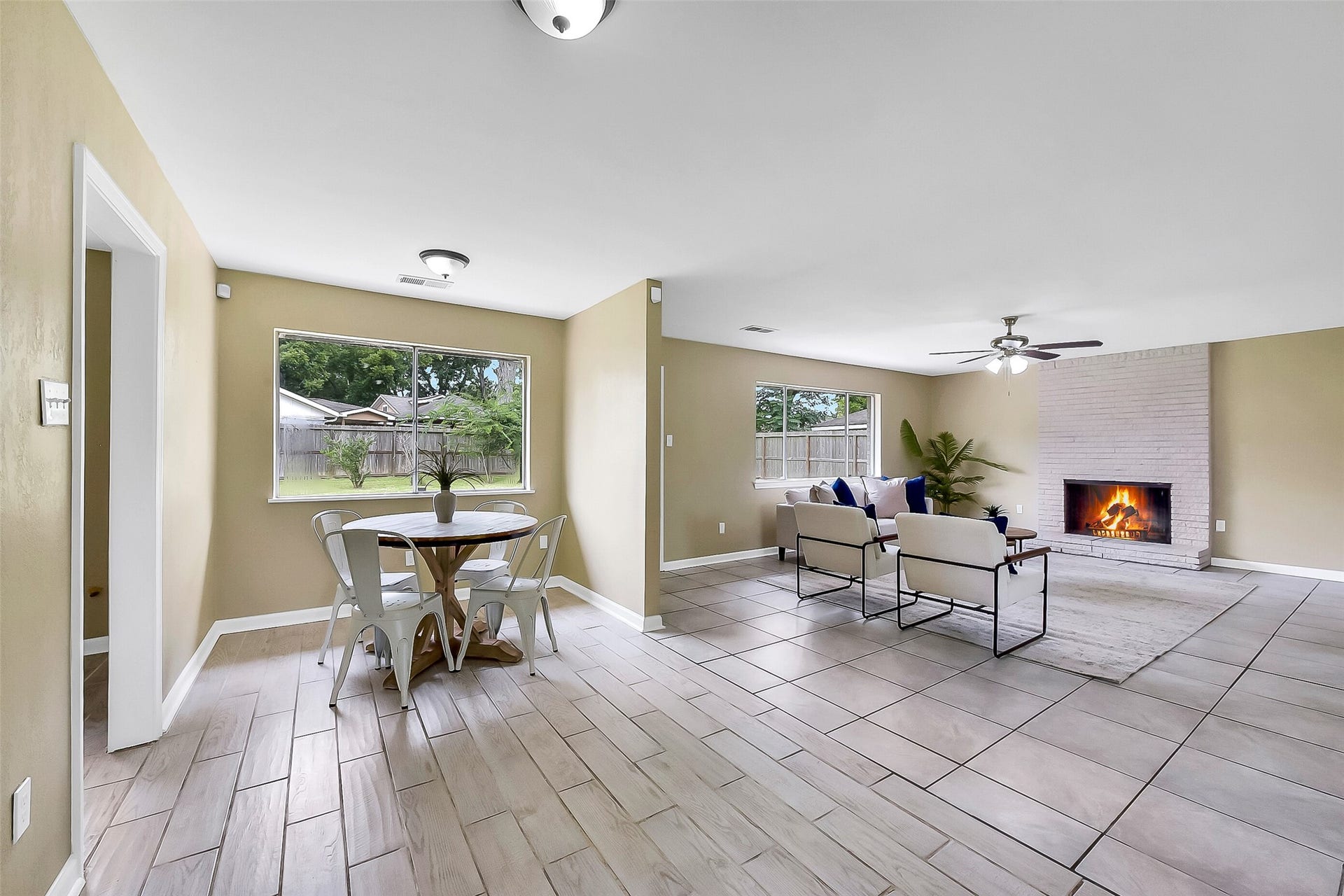 15503 Wandering Trail, Friendswood, TX 77546 This light & bright breakfast nook with wood-look tile floors and large windows overlooking the backyard is situated between the family room, the indoor utility room, and the kitchen.