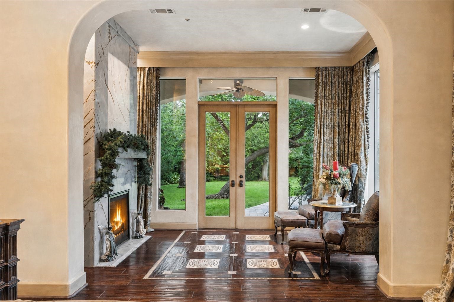 2 Lacewood Lane, Piney Point Village, TX 77024 A serene owners suite sitting retreat with fireplace, elegant architectural framing, and peaceful views of the private grounds.