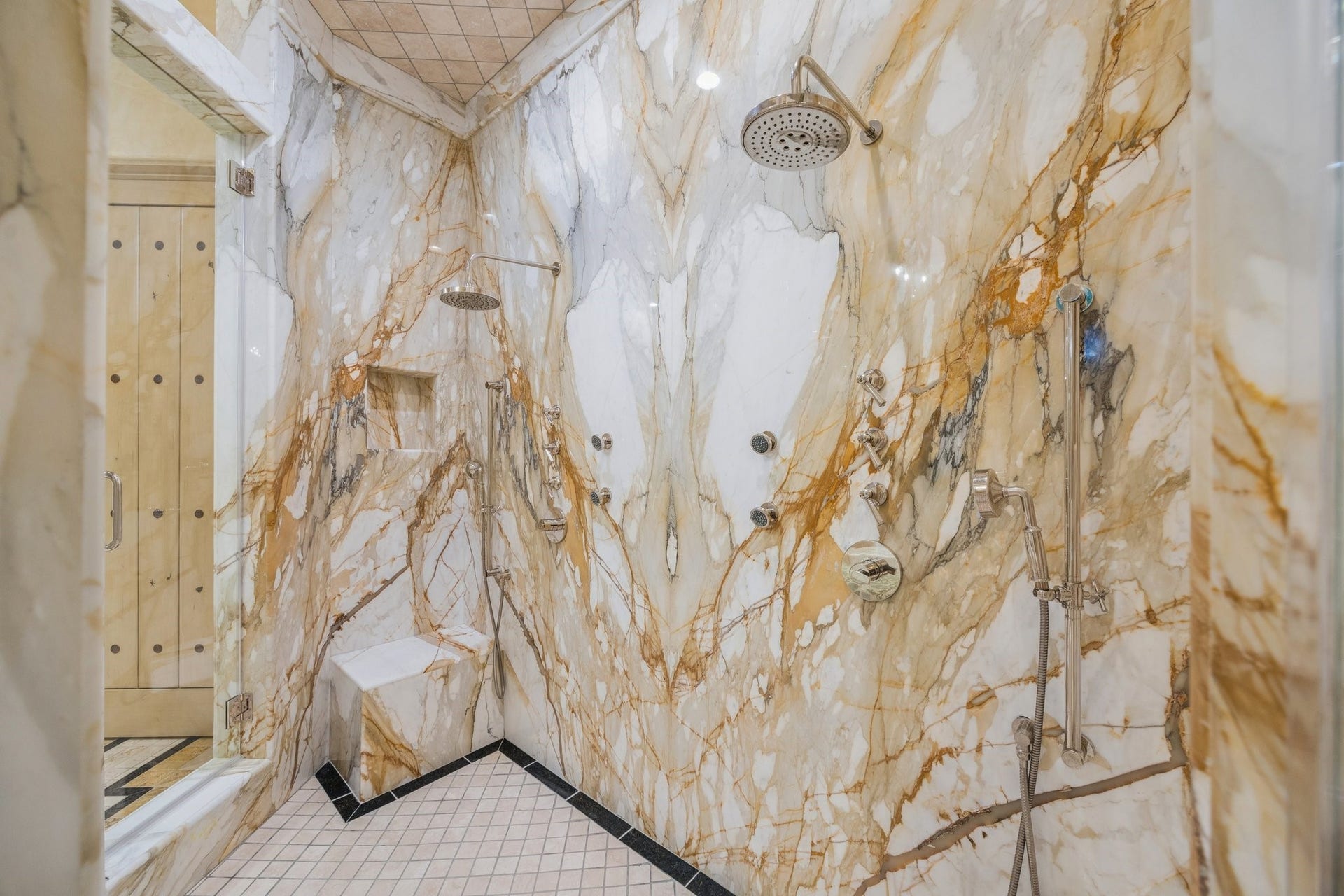 2 Lacewood Lane, Piney Point Village, TX 77024 Statement walk-in shower clad in bookmatched imported Italian marble with striking custom detail.