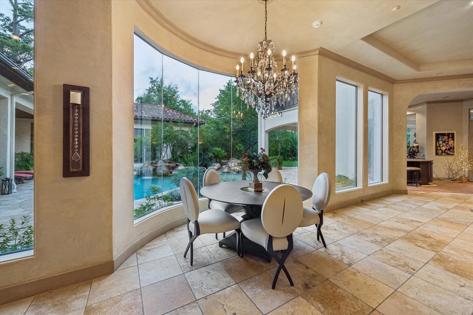 2 Lacewood Lane, Piney Point Village, TX 77024 Light-filled breakfast area framed by expansive windows with serene views of the pool and outdoor living spaces.