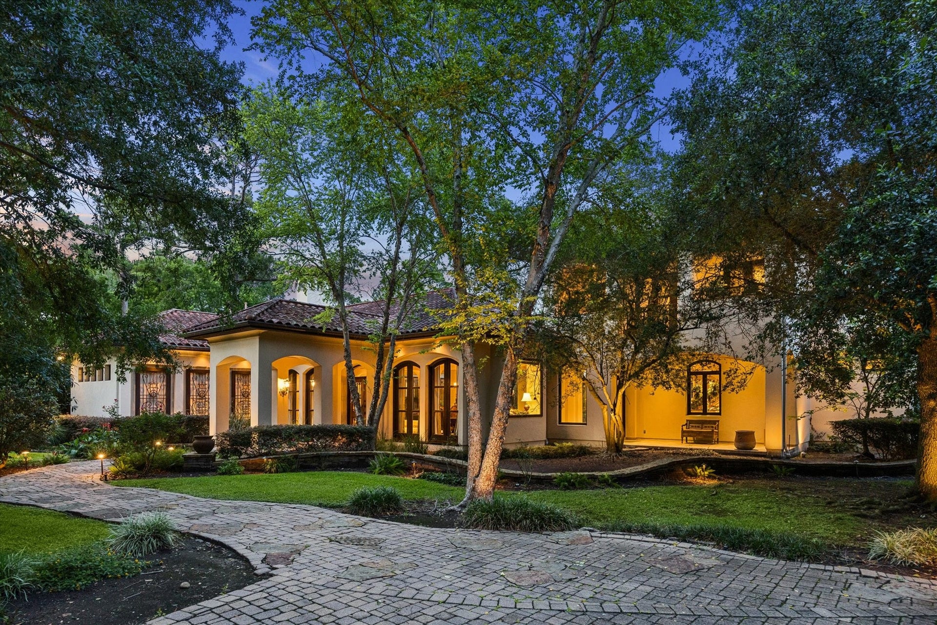 2 Lacewood Lane, Piney Point Village, TX 77024 Elegant Mediterranean estate tucked away from the road on a secluded Piney Point lot with mature landscaping and a private, estate-like setting.