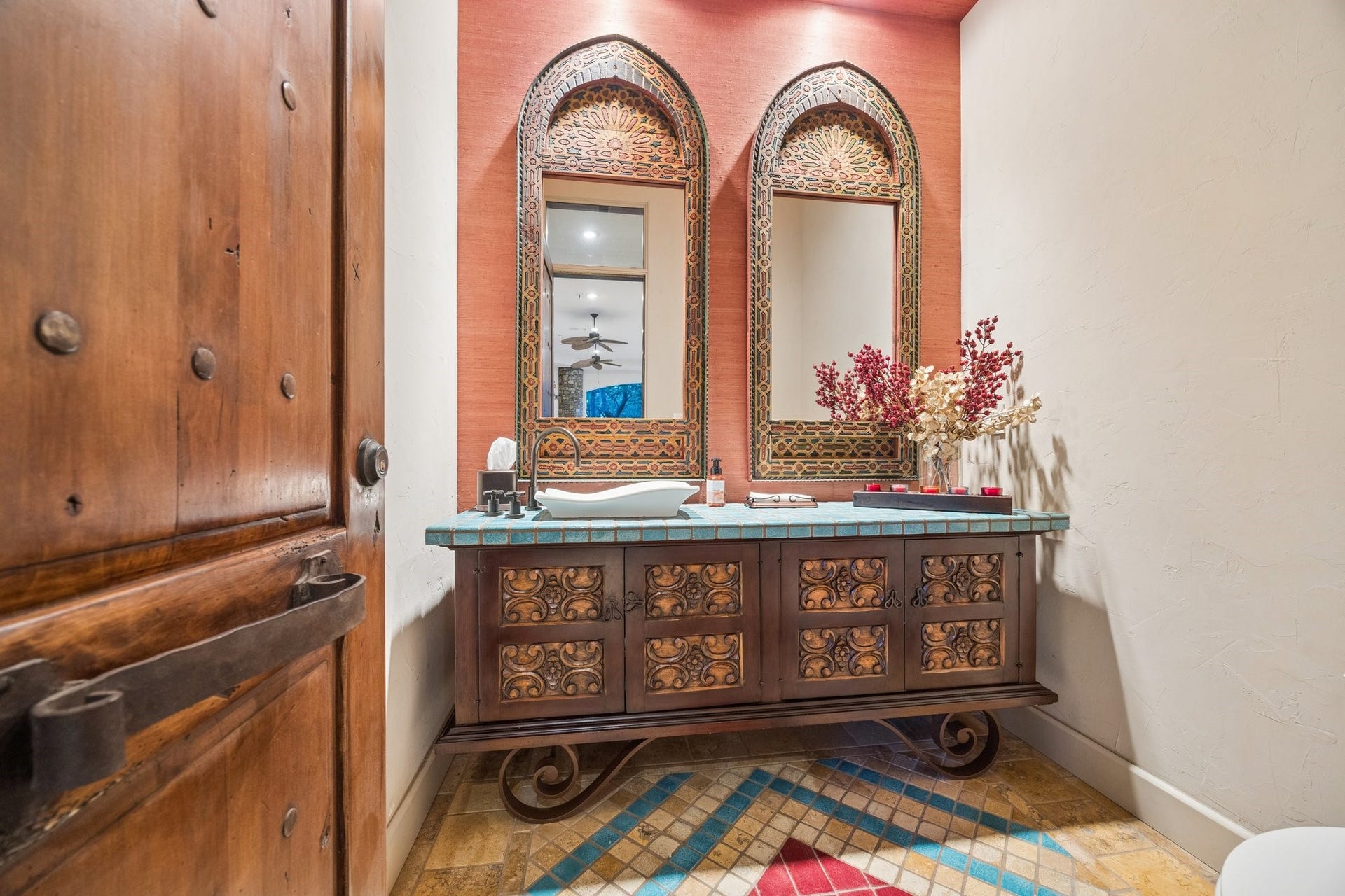 2 Lacewood Lane, Piney Point Village, TX 77024 Outdoor powder room featuring a custom vanity, colorful tile accents, and distinctive Mediterranean-inspired details.