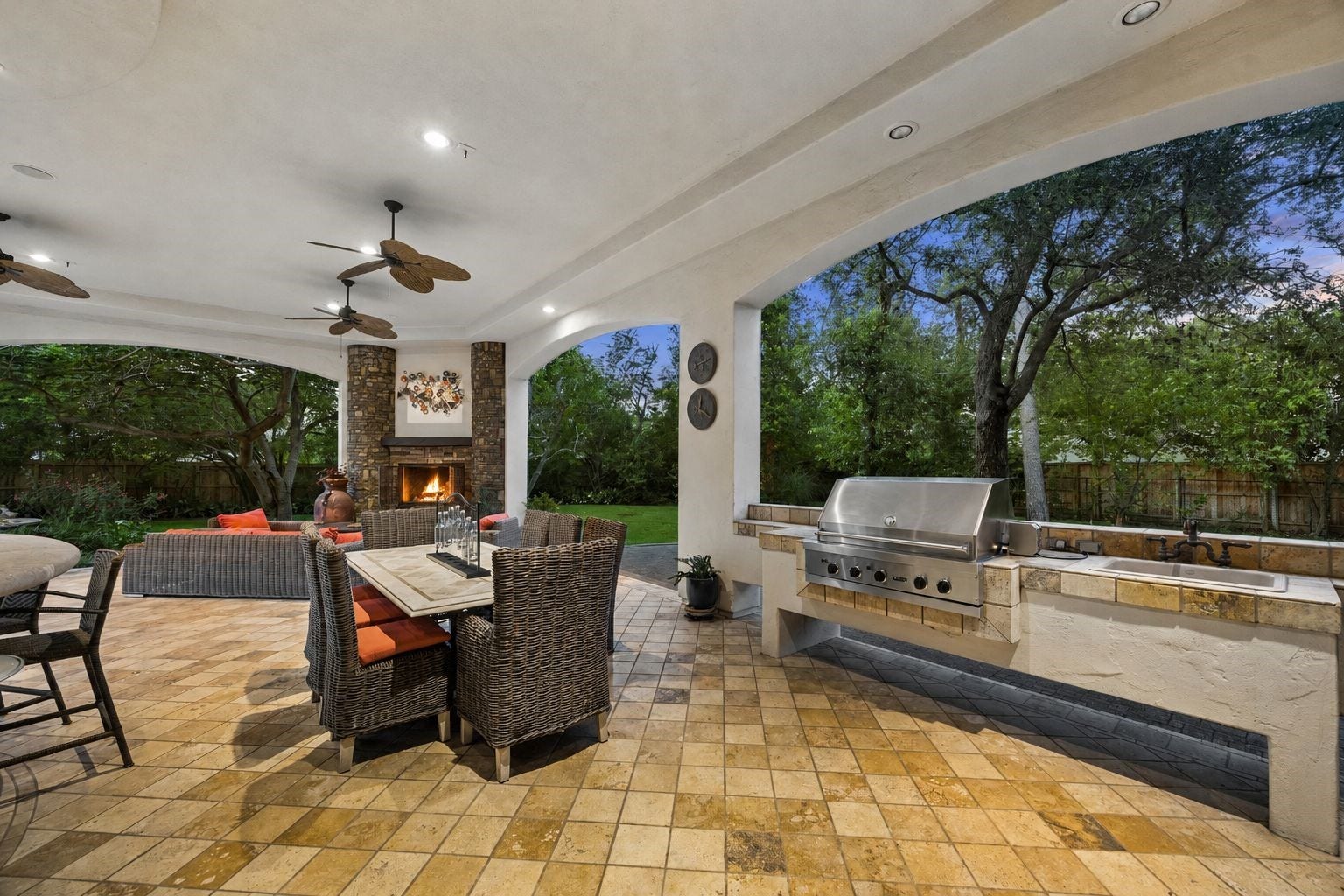 2 Lacewood Lane, Piney Point Village, TX 77024 Expansive covered loggia designed for entertaining with outdoor dining, built-in grill, fireplace, and convenient outdoor powder room.