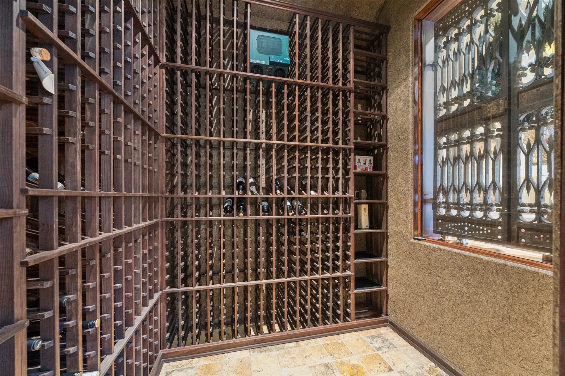 2 Lacewood Lane, Piney Point Village, TX 77024 Dedicated wine cellar with extensive custom racking and display storage for a serious collection.