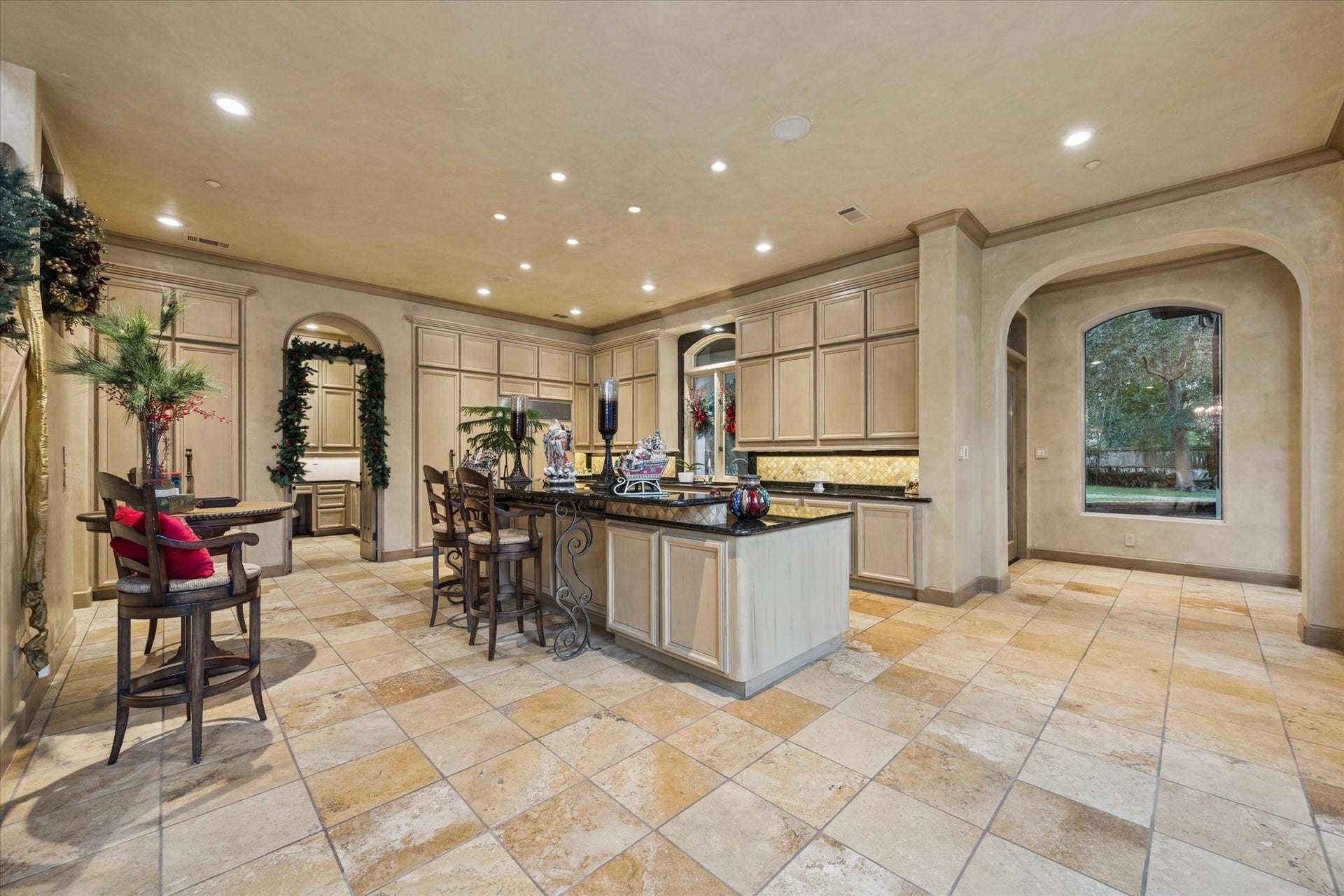 2 Lacewood Lane, Piney Point Village, TX 77024 A wider kitchen perspective highlighting the large island, extensive cabinetry, and convenient flow to the butlers pantry.