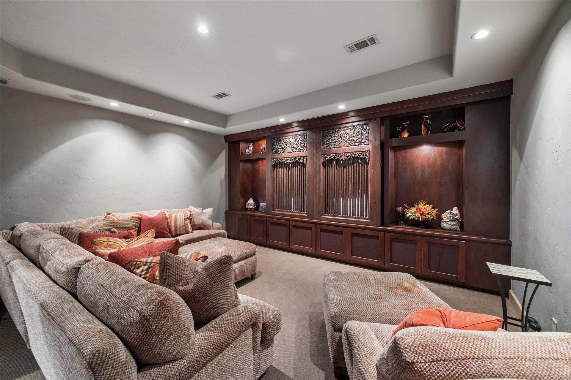 2 Lacewood Lane, Piney Point Village, TX 77024 Sophisticated upstairs media room featuring custom built-ins and oversized lounge seating for an elevated home theater experience.