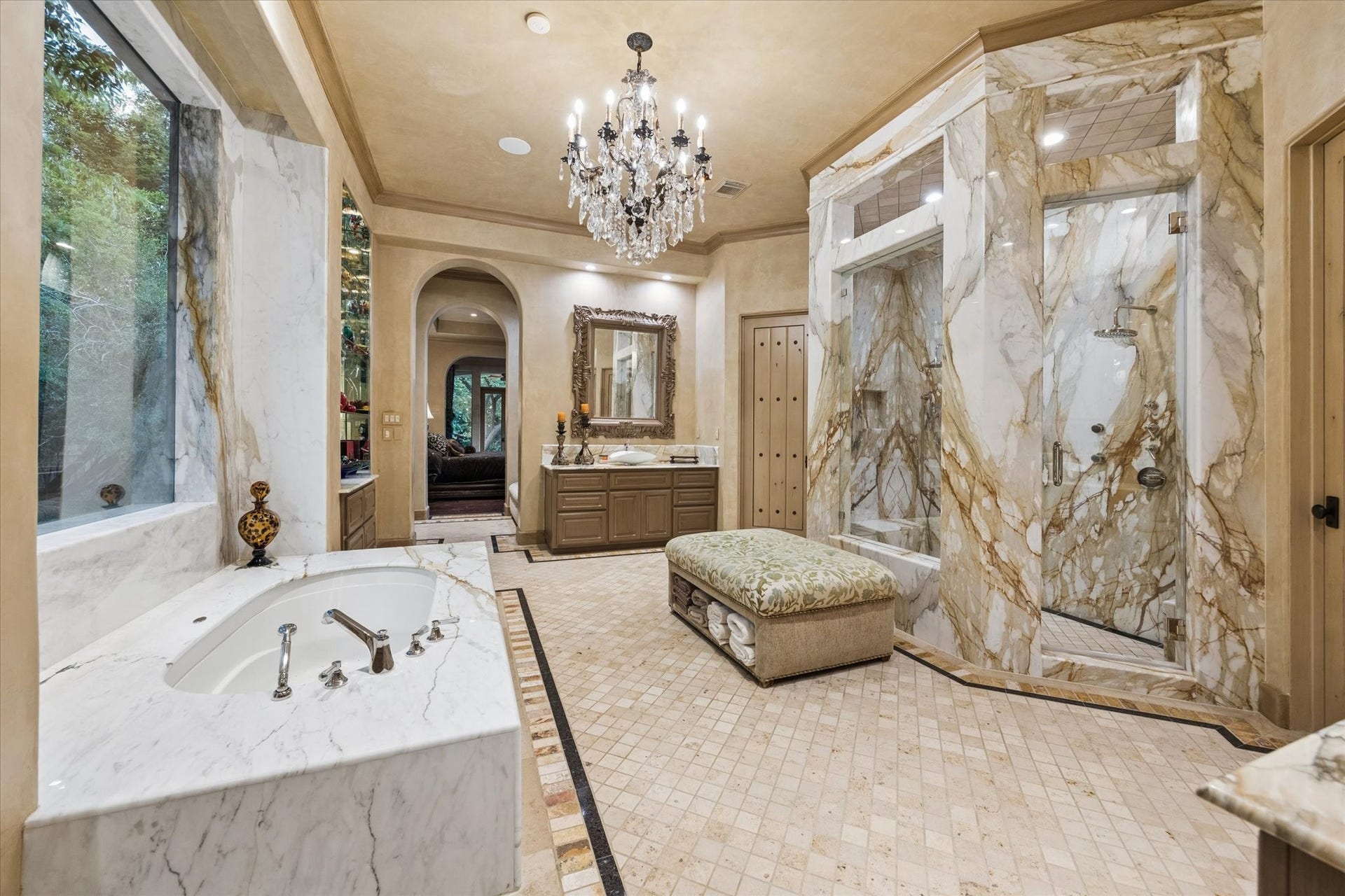 2 Lacewood Lane, Piney Point Village, TX 77024 Spa-inspired owners bath featuring a dramatic marble shower, soaking tub, dual vanity, and refined designer finishes.