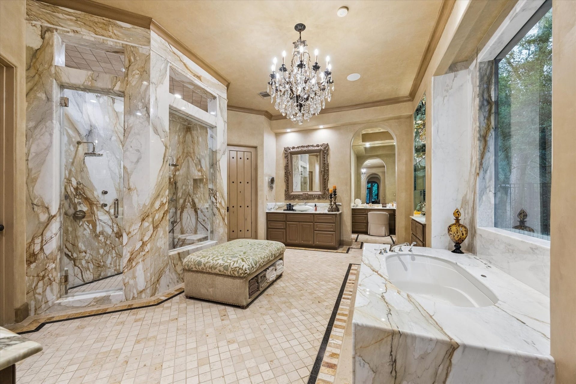 2 Lacewood Lane, Piney Point Village, TX 77024 Additional owners bath view highlighting the marble soaking tub, dramatic walk-in shower, and separate vanity area leading to the custom-designed closet.