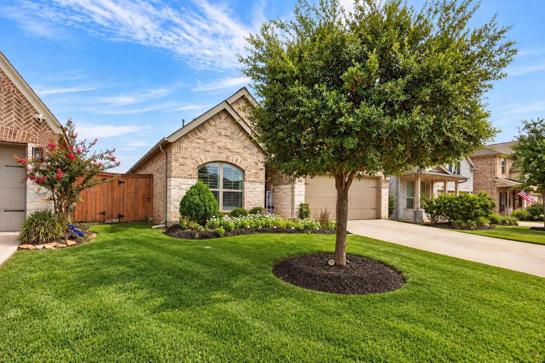 23026 Needlegrass Road, Katy, TX 77493 Inviting front entry with mature landscaping and welcoming front porch.