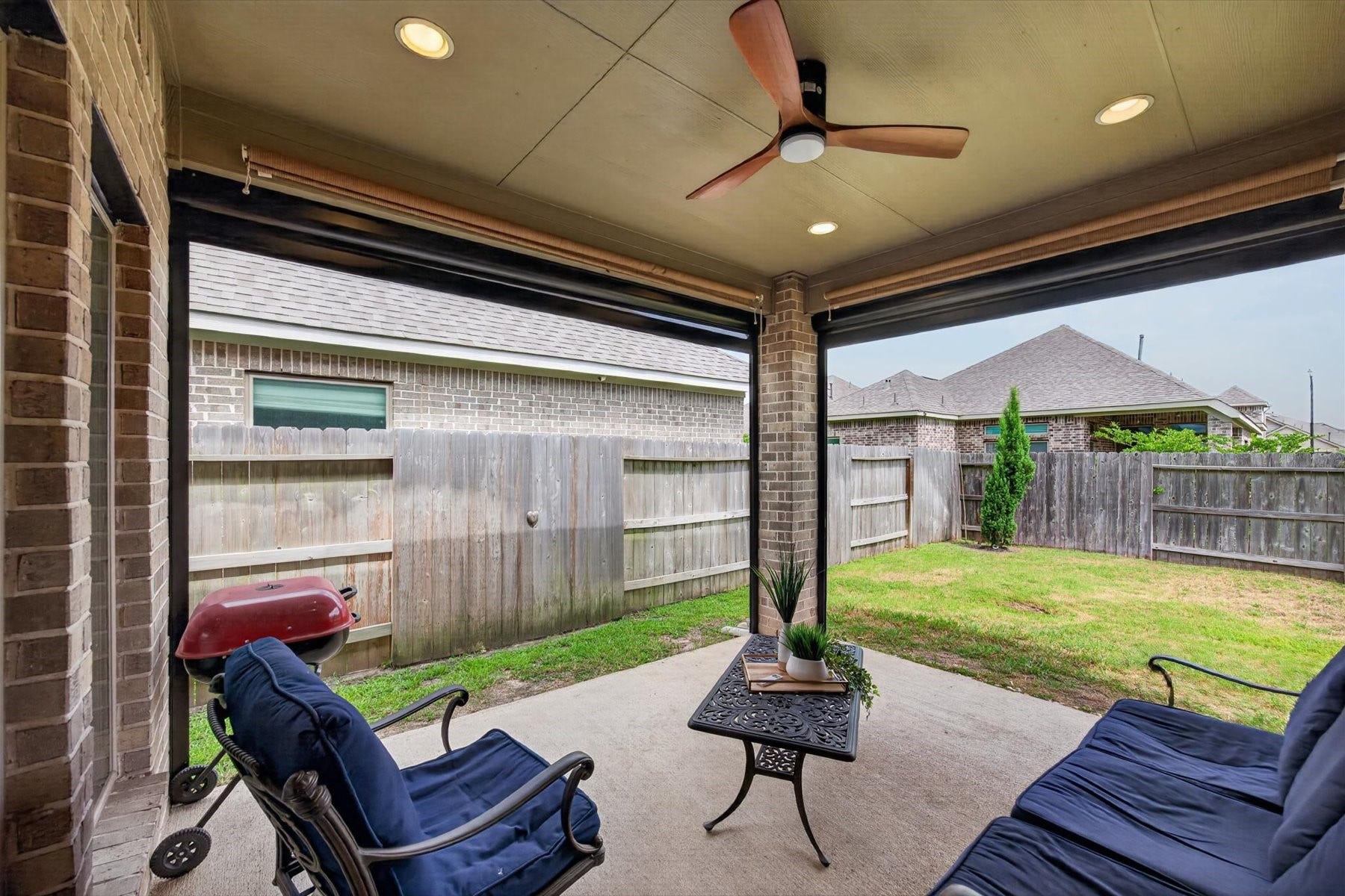 23026 Needlegrass Road, Katy, TX 77493 Relax outdoors all year round with remote controlled screened covered patio with added privacy.