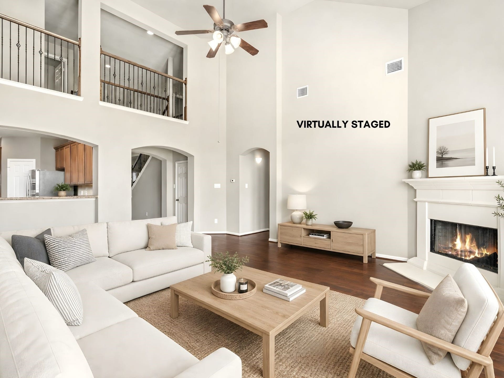 5307 Amber Sky Lane, Rosharon, TX 77583 Soaring two-story ceilings, rich hardwood floors, and a stunning gas fireplace with custom mantel set the stage in this virtually staged family room. A dramatic, light-filled space designed for elevated everyday living and effortless entertaining.