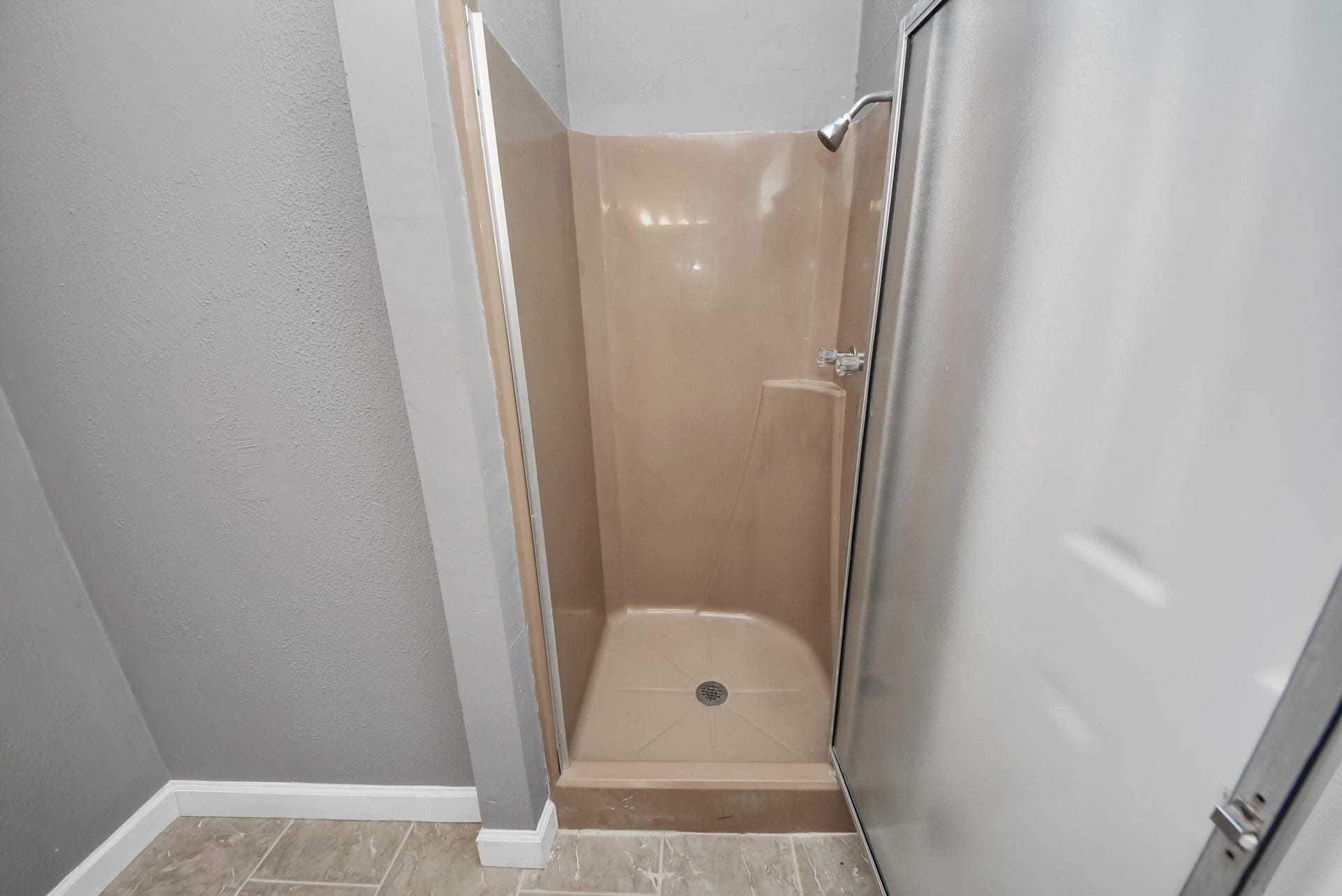 5241 County Road 819, Brazoria, TX 77422 The secondary bathroom features a practical shower and stylish vanity, providing ample storage for essentials.