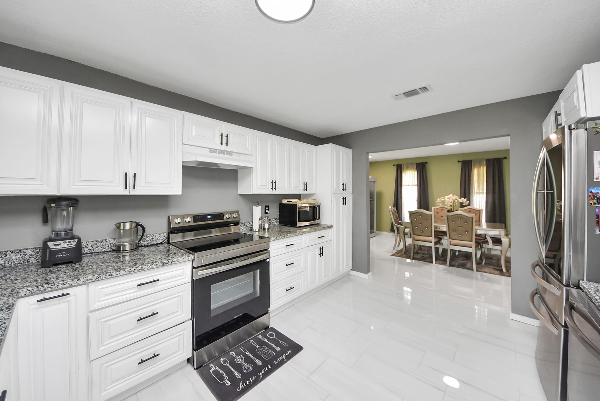 5241 County Road 819, Brazoria, TX 77422 Striking granite countertops beautifully complement the newly painted cabinetry, while the handlers of all doors add just the right touch of visual interest.