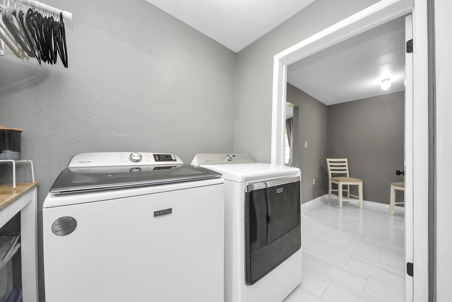 5241 County Road 819, Brazoria, TX 77422 This versatile laundry room, conveniently located off the kitchen, also functions as another storage area, completed with shelving, making it ideal for keeping your space organized.