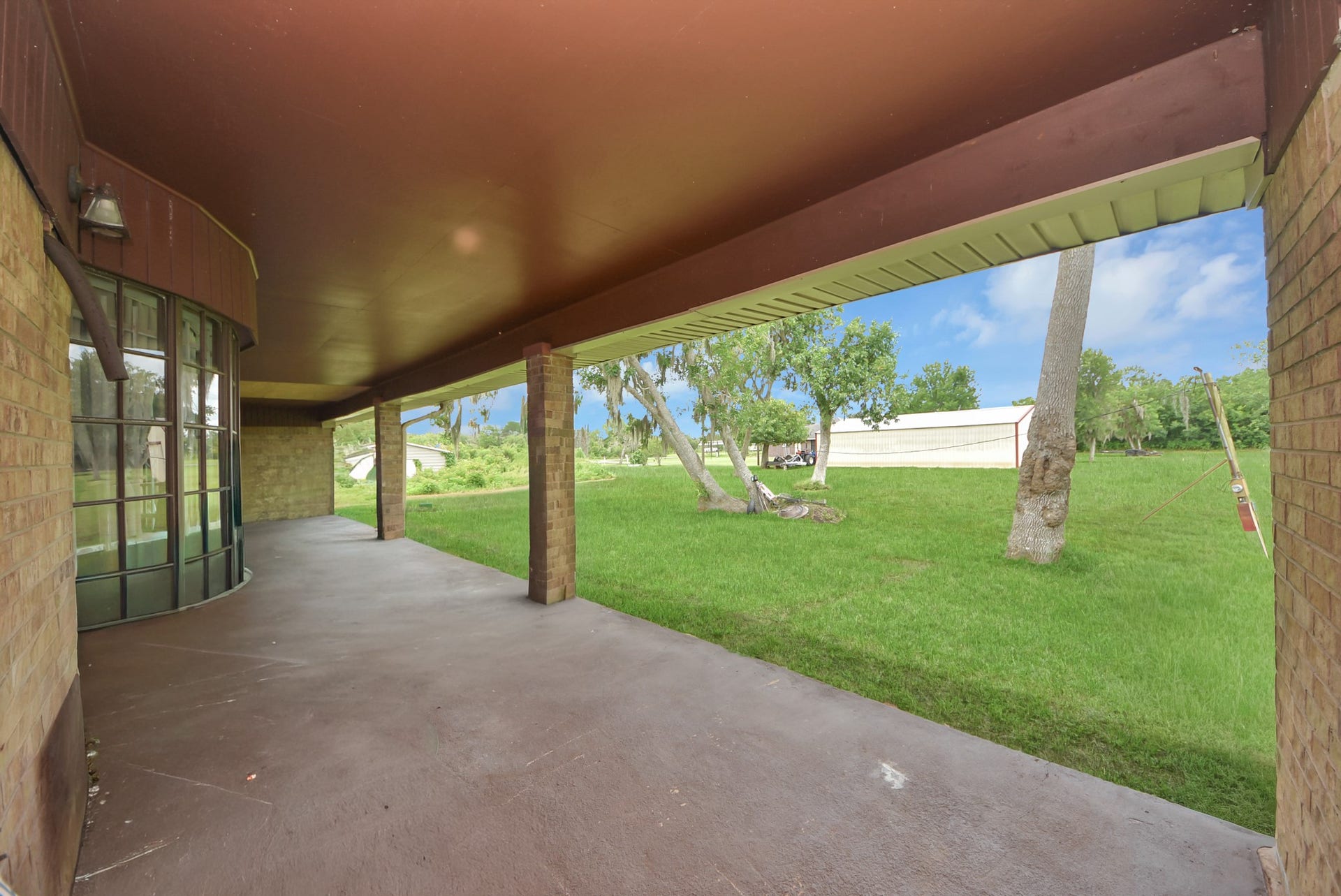 5241 County Road 819, Brazoria, TX 77422 Step outside to your own private backyard retreat, featuring a covered patio and enough space for yard activities or for relaxation, or entertaining guests.