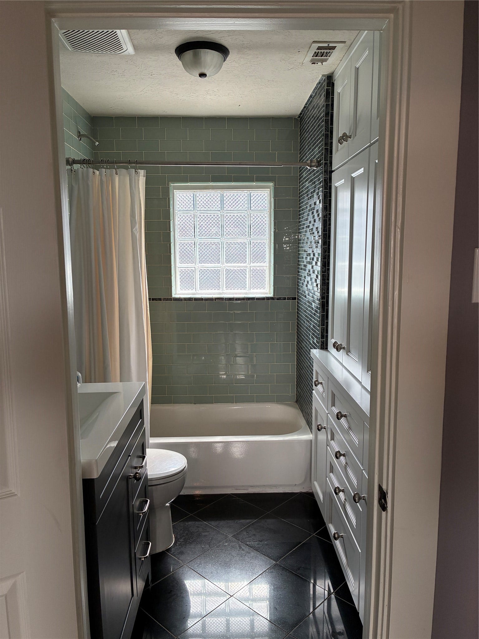 808 Dorothy Street, Houston, TX 77007 Nicely re-done bathroom with ample storage space.