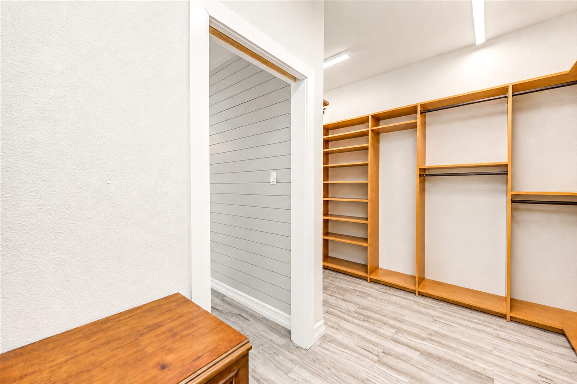 6211 Grovewood Lane, Houston, TX 77008 Custom built-in shelving and generous hanging space provide thoughtful organization in the spacious primary closet.