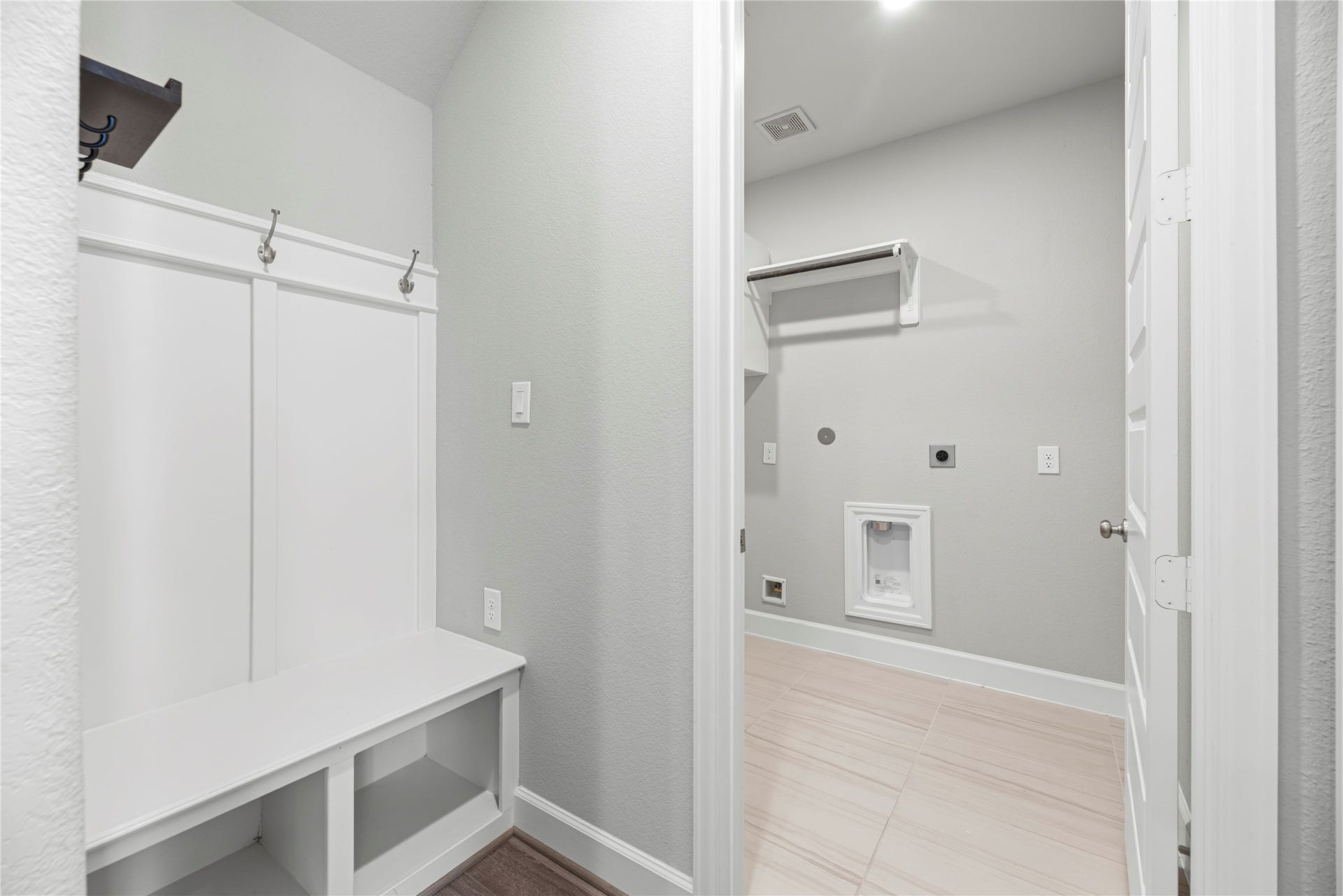 9511 Shaded Tree Drive, Missouri City, TX 77459 Mud rack and laundry room upon entering from the garage.