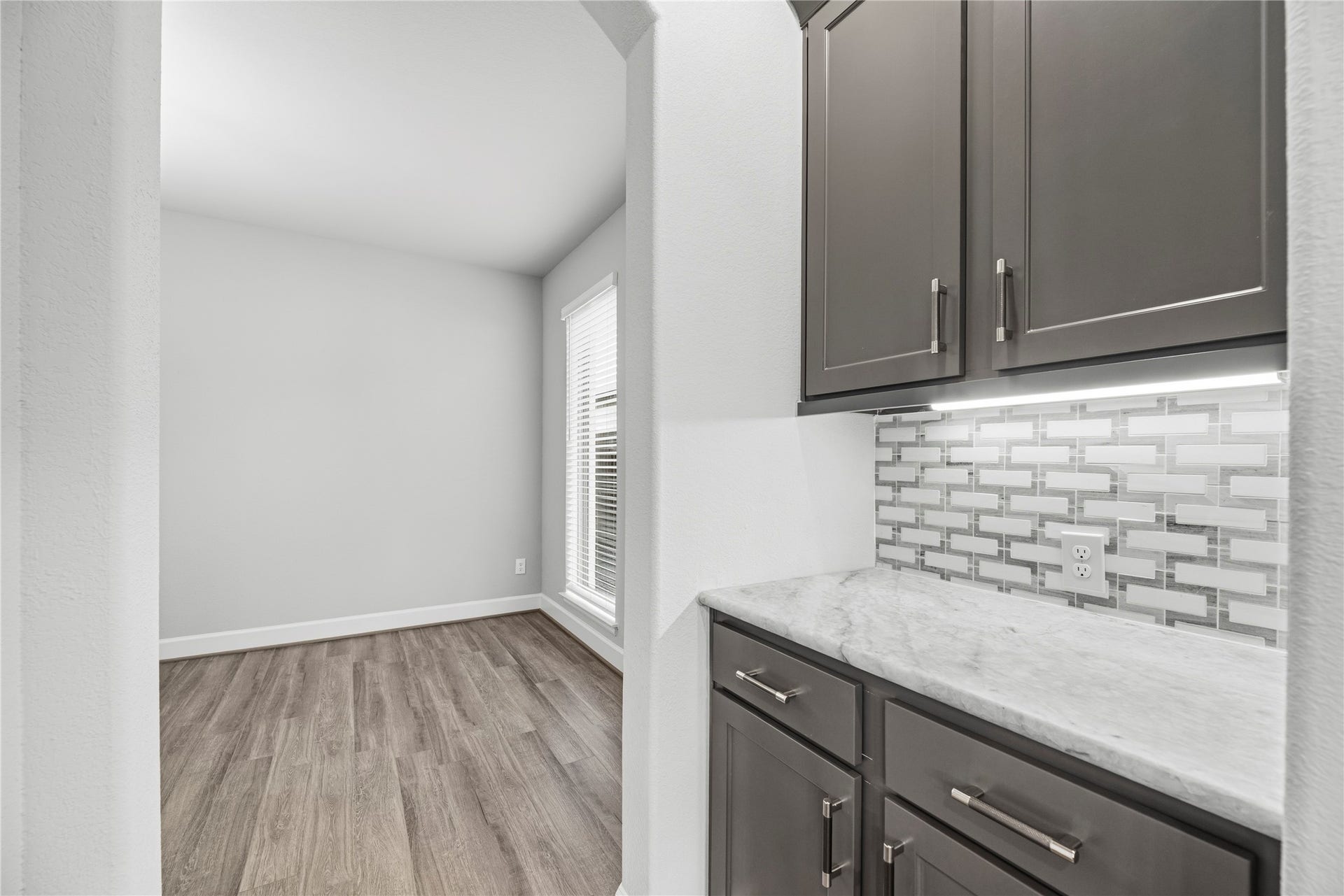 9511 Shaded Tree Drive, Missouri City, TX 77459 Butlers Pantry connecting the dining room and the kitchen. Perfect spot for your coffee bar.