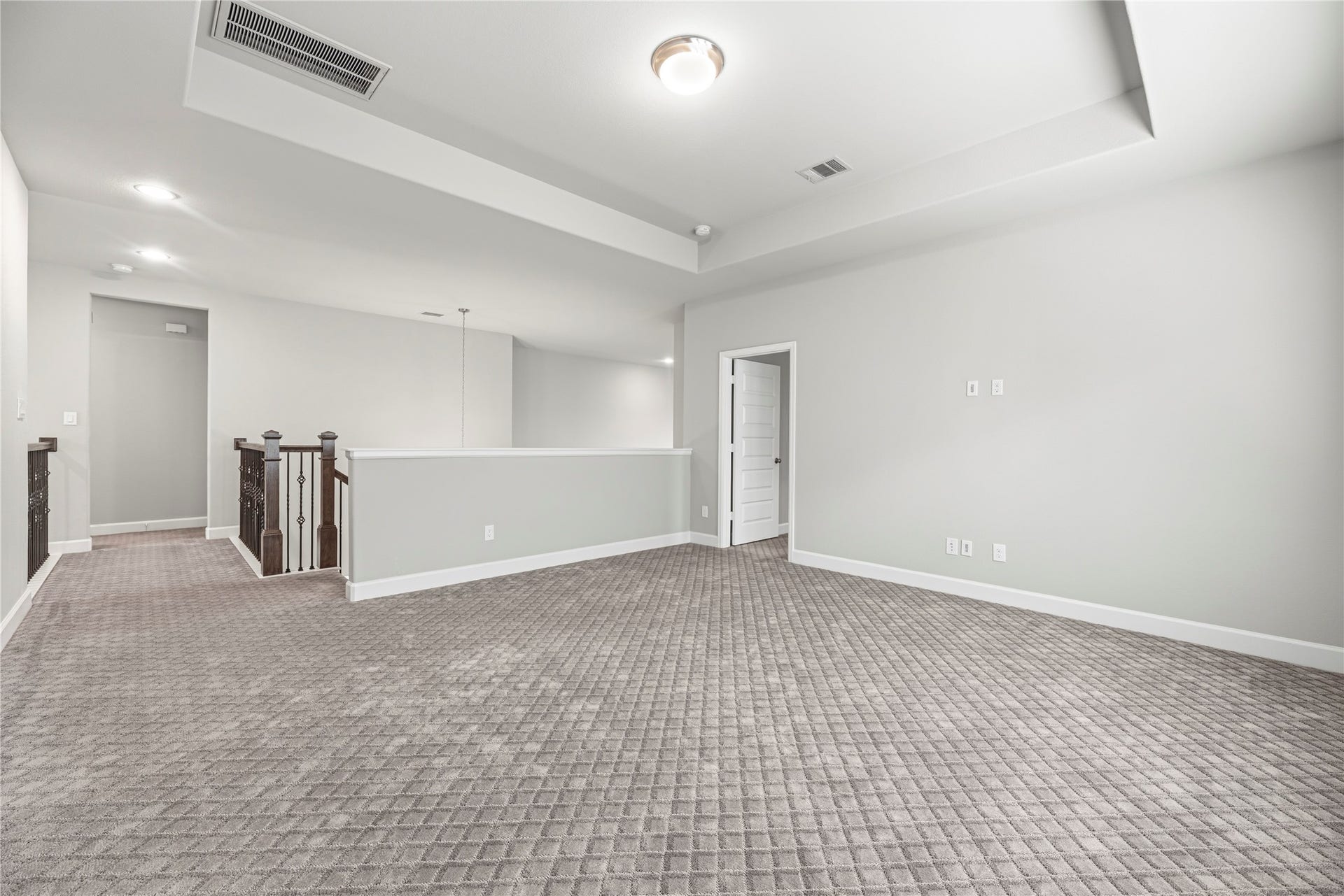 9511 Shaded Tree Drive, Missouri City, TX 77459 Game room located upstairs, complete with a tray ceiling, plush carpet.