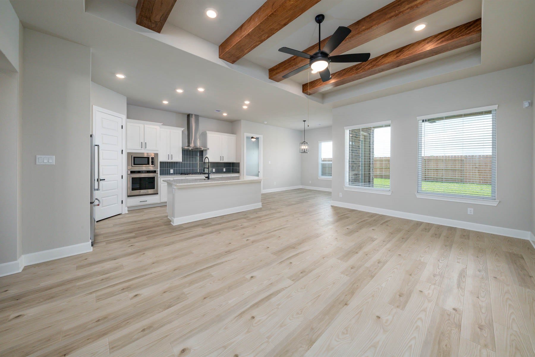 10506 Sutter Creek Drive, Iowa Colony, TX 77583 Bathed in natural light from expansive windows or open doorways, the family room exudes an airy and inviting ambiance, enhancing the sense of spaciousness and connection to the outdoors, creating an ideal setting for relaxation and enjoyment.