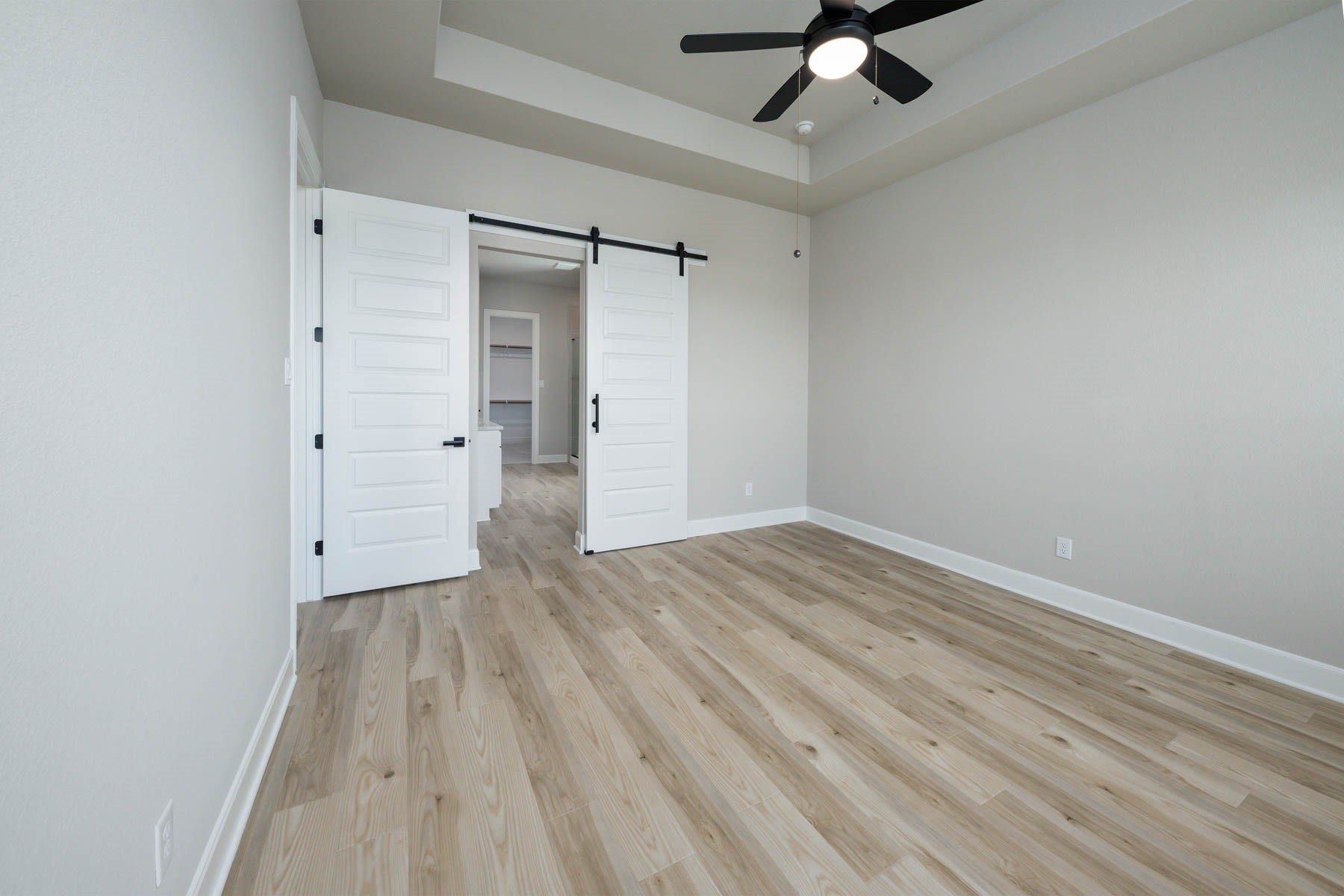 10506 Sutter Creek Drive, Iowa Colony, TX 77583 With its generous proportions and thoughtful design, the primary bedroom exudes a sense of spaciousness and tranquility, providing a serene haven where homeowners can escape and recharge, complete with a private en-suite bathroom for added convenience and comfort.