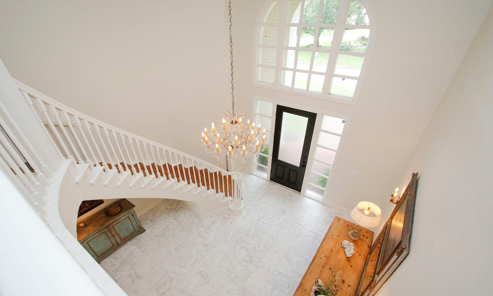 8515 Tranquil Park Drive, Spring, TX 77379 This photo is taken from the second floor cat walk showing the glowing marble floors in the entry.