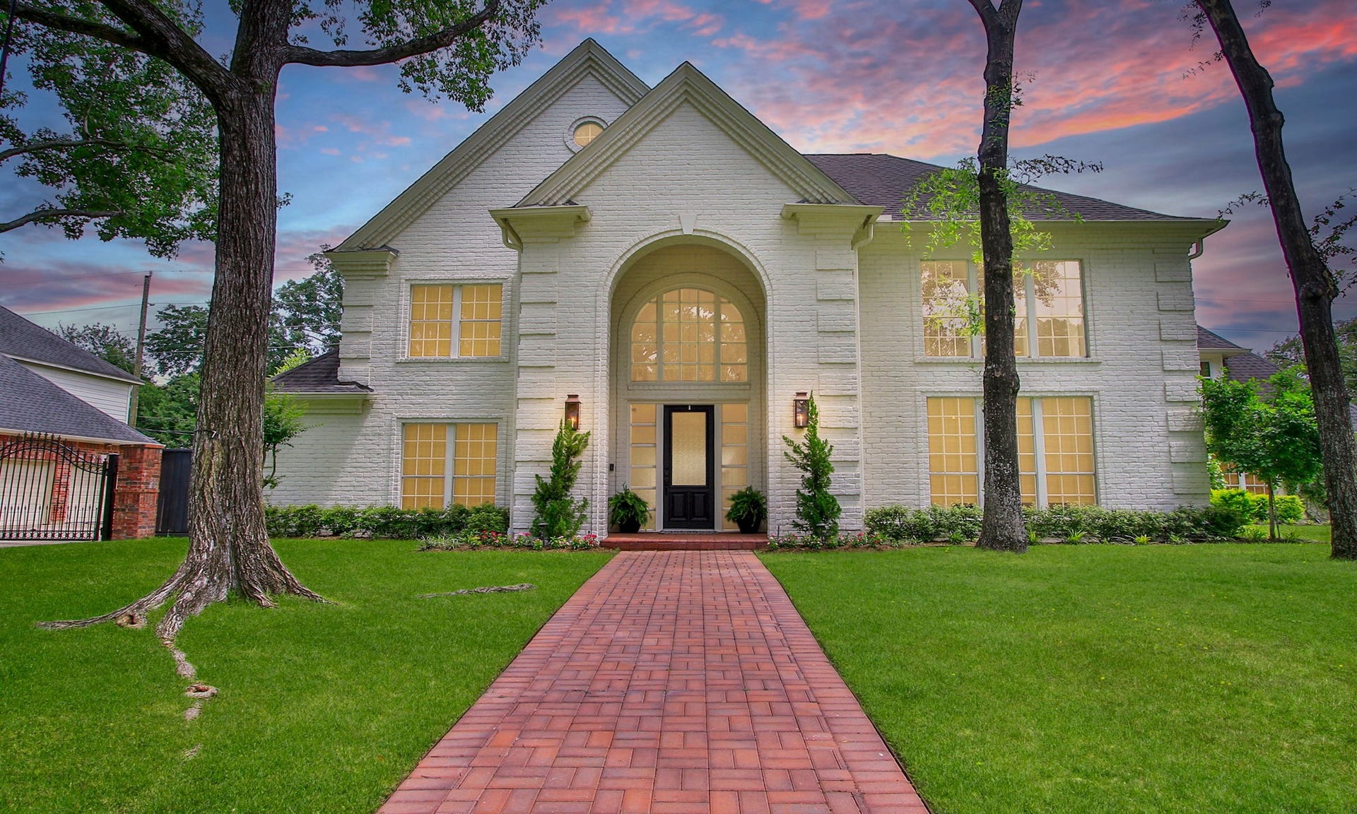 8515 Tranquil Park Drive, Spring, TX 77379 Newly painted brick exterior with brick paver walkway and two story arched entry.